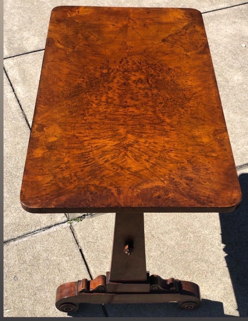 19th century English Regency sofa table. Beautiful tropical hardwood top over single drawer. Original casters.