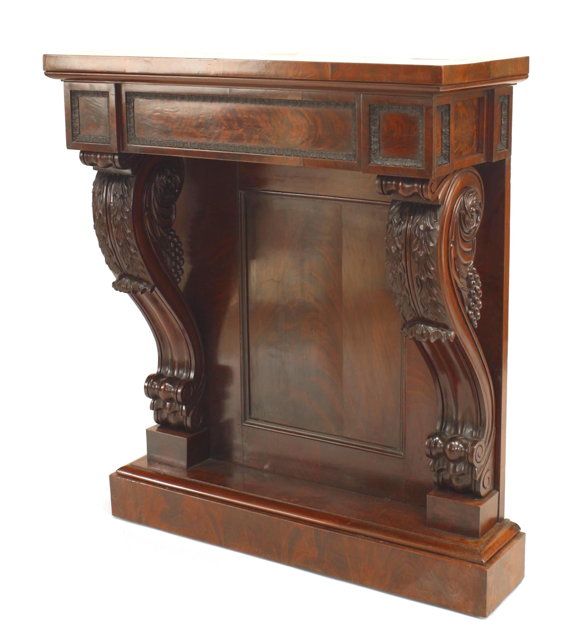 English Regency mahogany console table with carved scroll design sides framing a solid back panel with a platform base and a frieze under a rectangular top.
