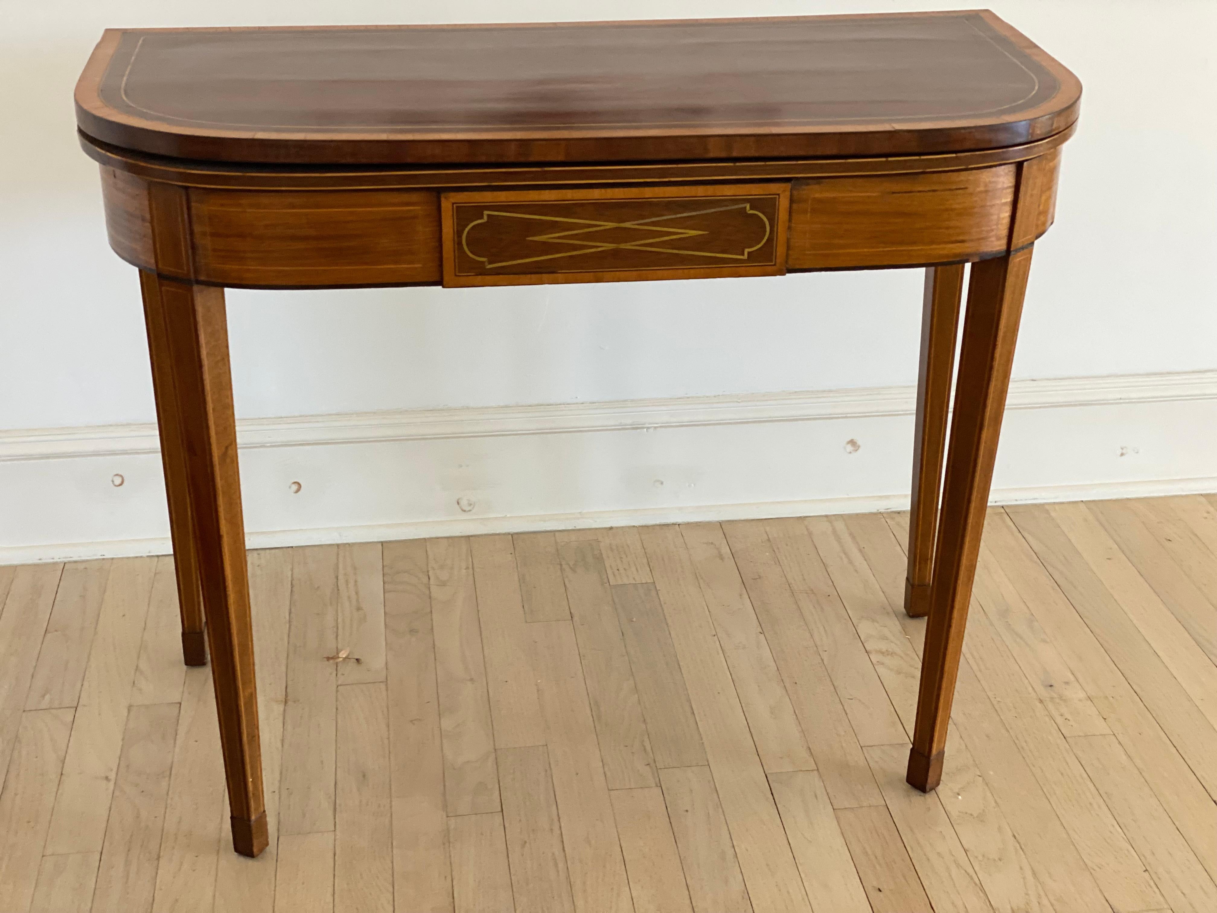 19th Century English Regency Mahogany Flip-Top Tea Table.
A lovely D-Shaped form, flip top works both as a console (when closed), or a tea table or games table, (when open).  It is constructed of mahogany and lighter fruit wood inlay banding around