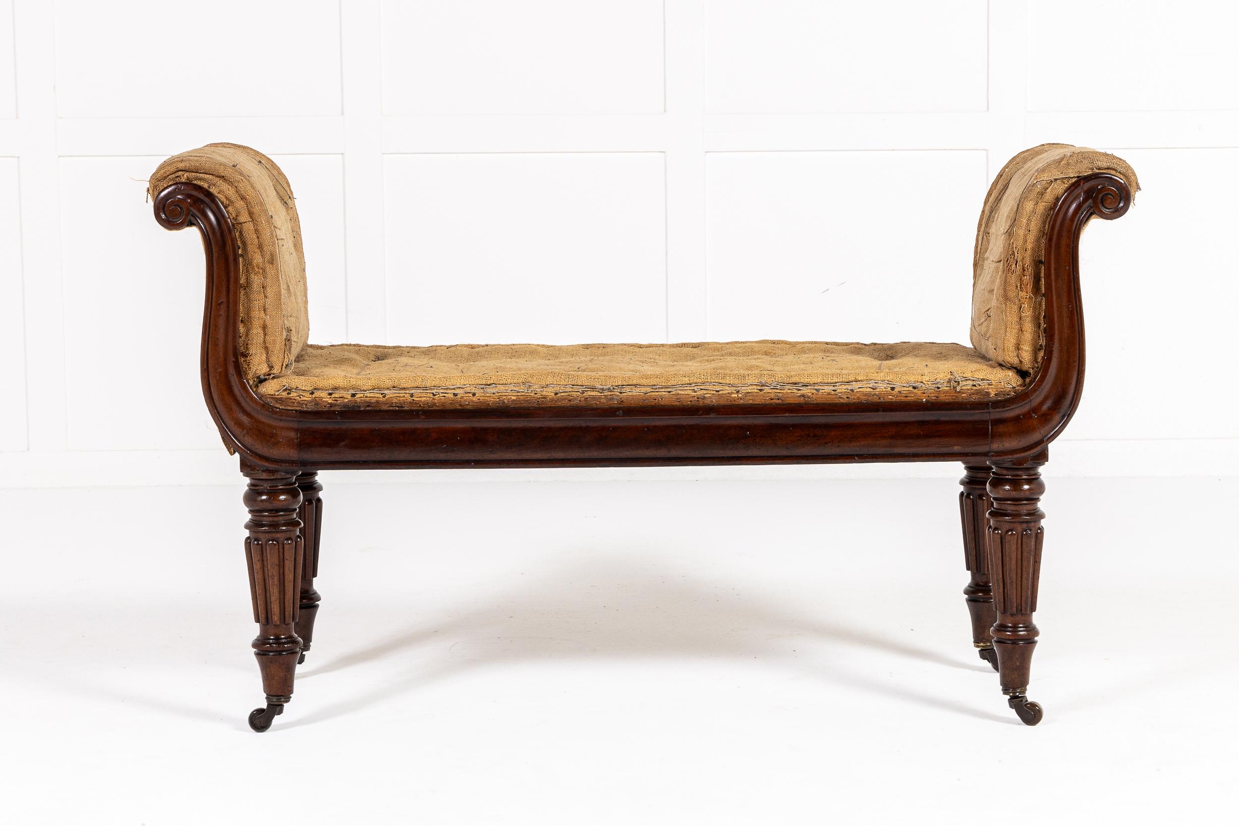 An English Regency Period Mahogany Window Seat, Probably by Gillows.

This elegant regency period window seat was designed to sit beneath a large window. It incorporates a finely moulded scrolling mahogany frame and four elegant turned legs with