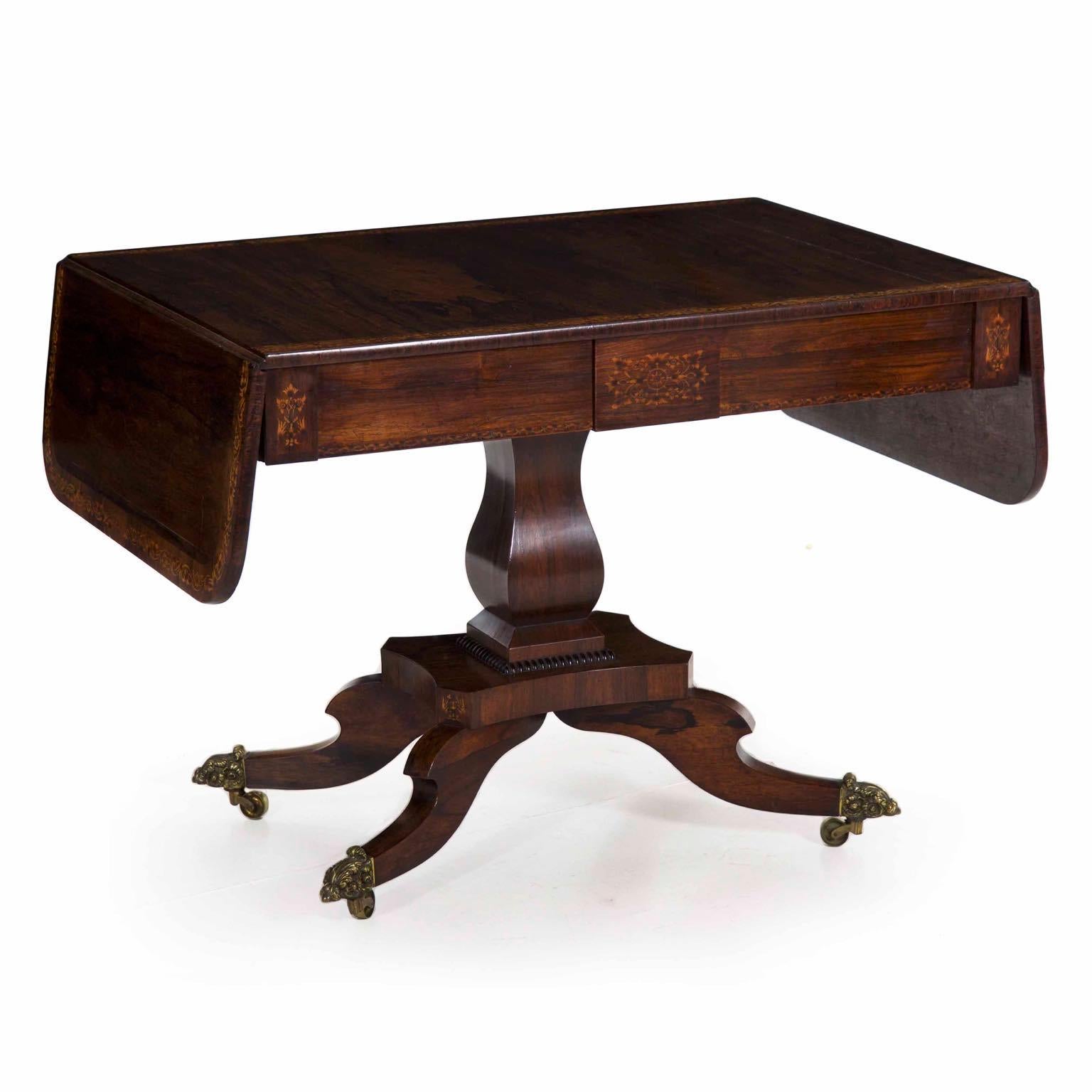 A very fine English Regency inlaid rosewood sofa table
London, circa 1820-1840

A carefully crafted work from the second quarter of the 19th century, this Fine Regency period sofa table is built with precision joinery and the very highest quality