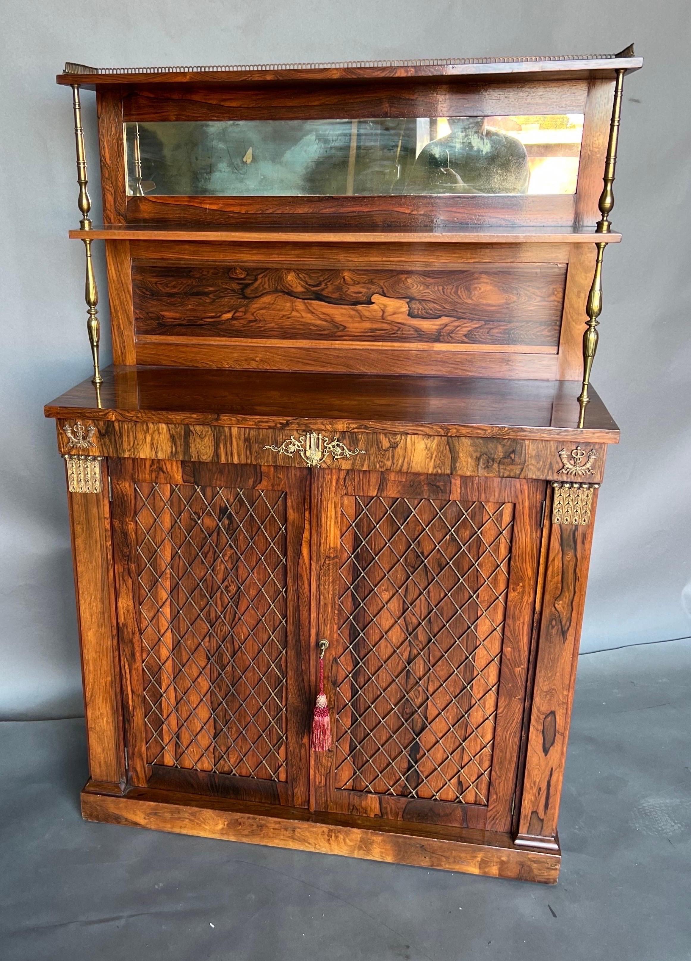19th Century English Regency rosewood chiffonier or bar. Great size and color. The doors feature wire work over original rosewood panels instead of fabric. Great bronze mounts.