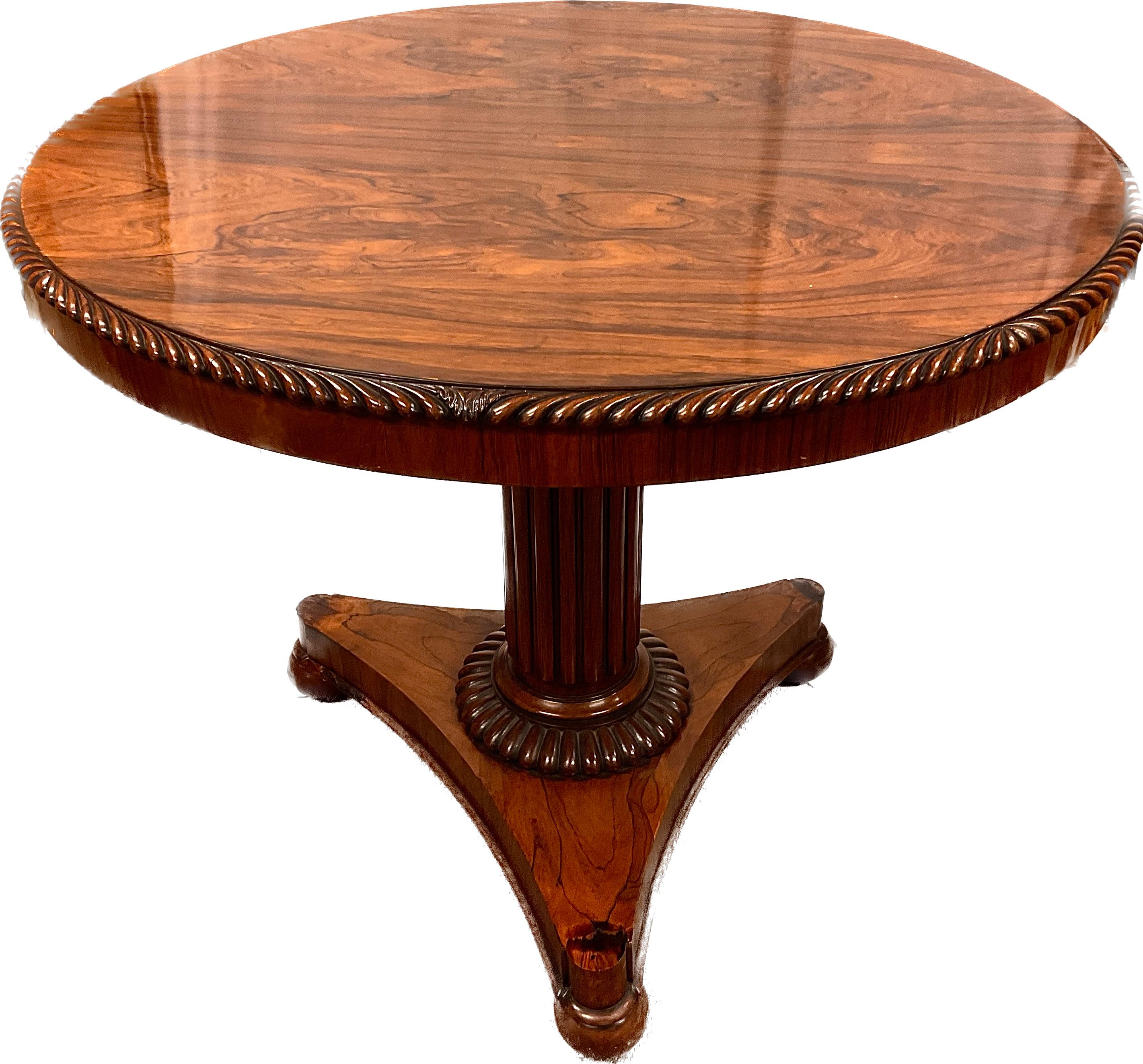 This is a very rare English Regency period Roulette table. The round rosewood top with gadroon edge, lifts off to reveal roulette wheel. Foliate motif black and white bone center panel, alternating red and black chapter ring with additional 0 and 00