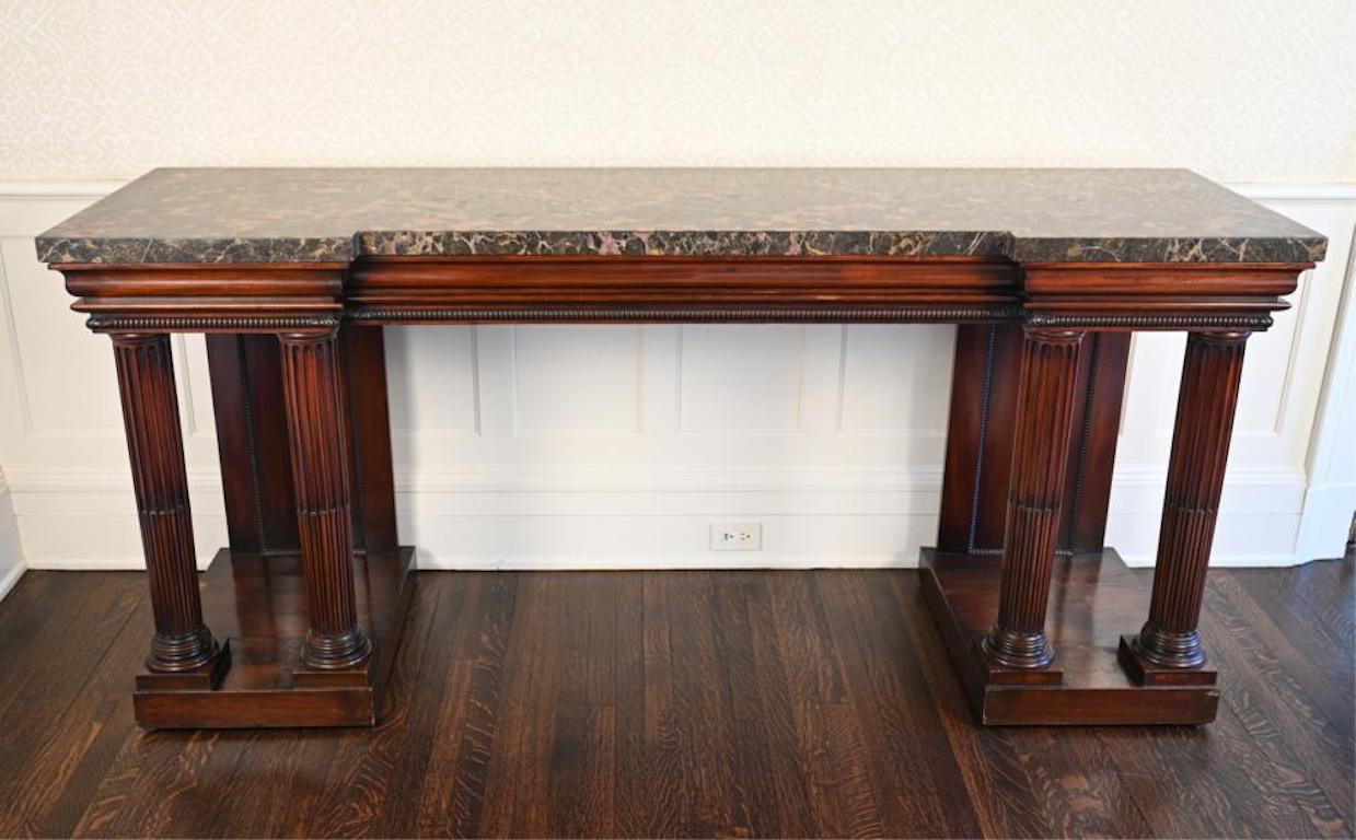 English Regency console or serving table. Brown marble top. Neoclassical stop fluted columns supporting break fronted crown moulding and brown figured marble top. Would make a wonderful sideboard or serving table. Possibly Irish

Provenance: A