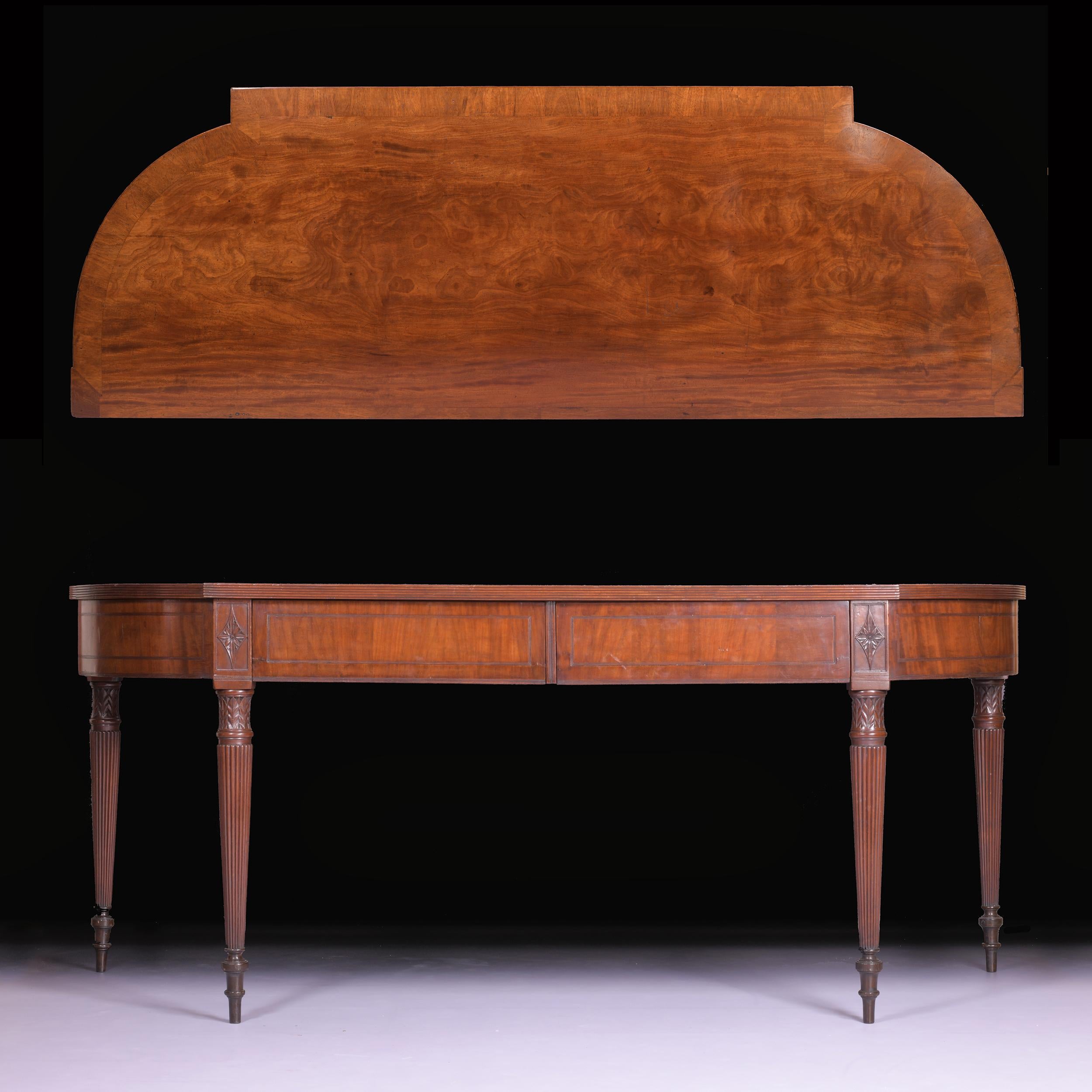 A superb early Regency mahogany breakfront serving table attributed to Gillows of Lancaster, constructed from the finest quality coloured & figured mahogany, the shaped frieze with a pair of central drawers resting on four elegant turned legs with
