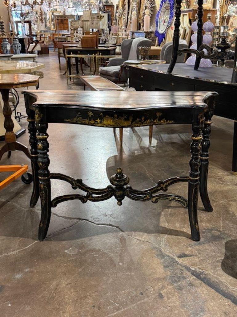 The 19th Century English Regency Style Hand Painted Chinoiserie Consoles are antique pieces featuring a traditional design influenced by Chinese art. These consoles exhibit intricate hand-painted details and are crafted in the Regency style popular
