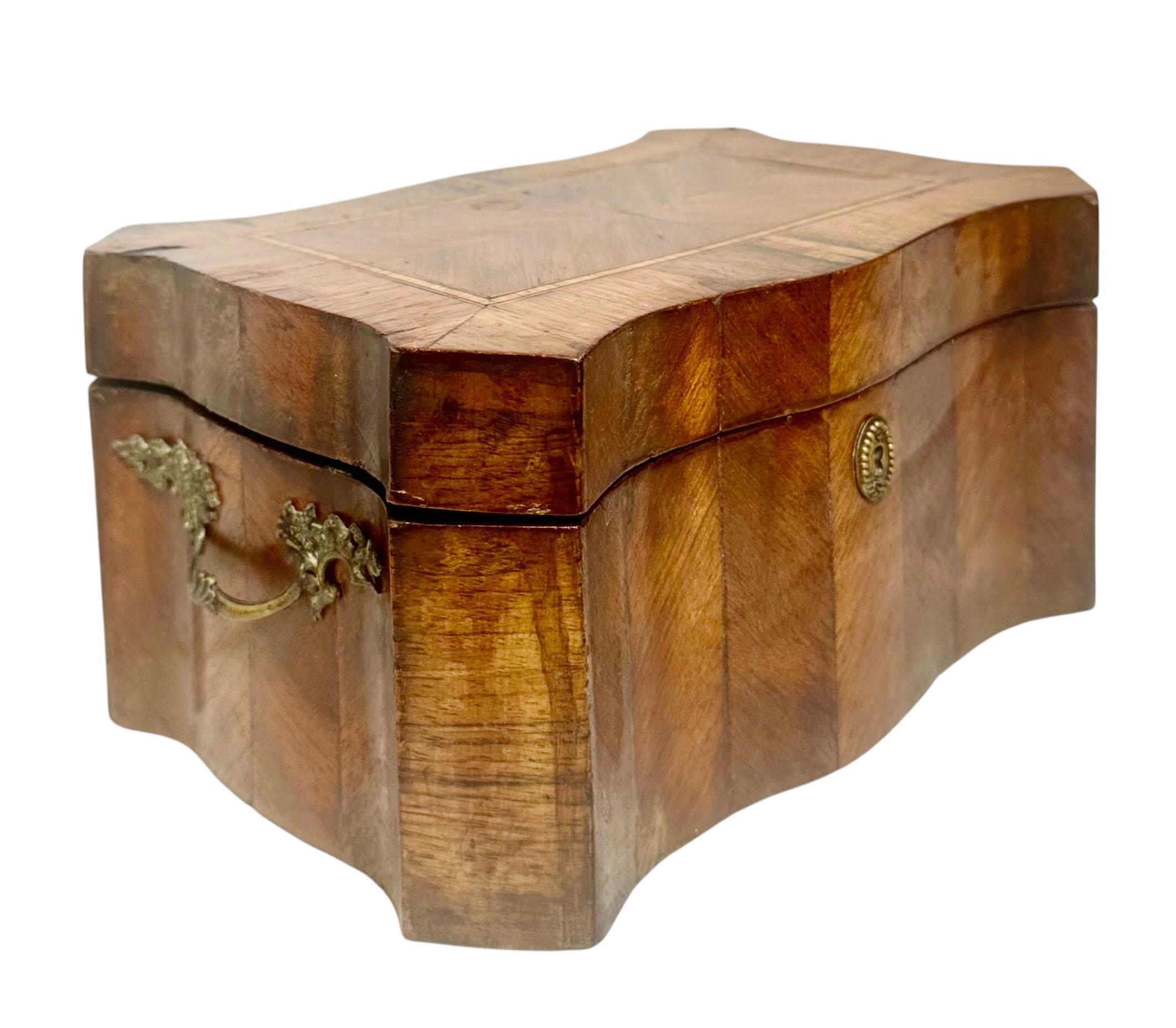  beautiful 19th century English Regency style trinket box, showcasing exquisite craftsmanship and attention to detail. The box features intricate inlay work across the surface, highlighting the elegance and refinement associated with the Regency