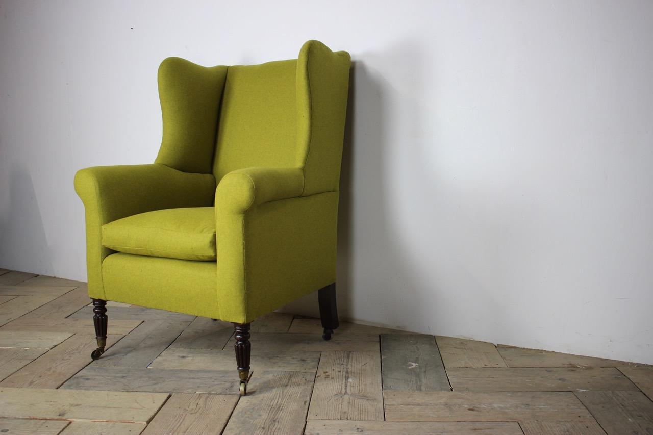 A good, early 19th century English Regency wingback armchair, with great presence, having been recently reupholstered by us in a green wool with a lovely colour, that will mix well in either a classic or contemporary setting. 

England