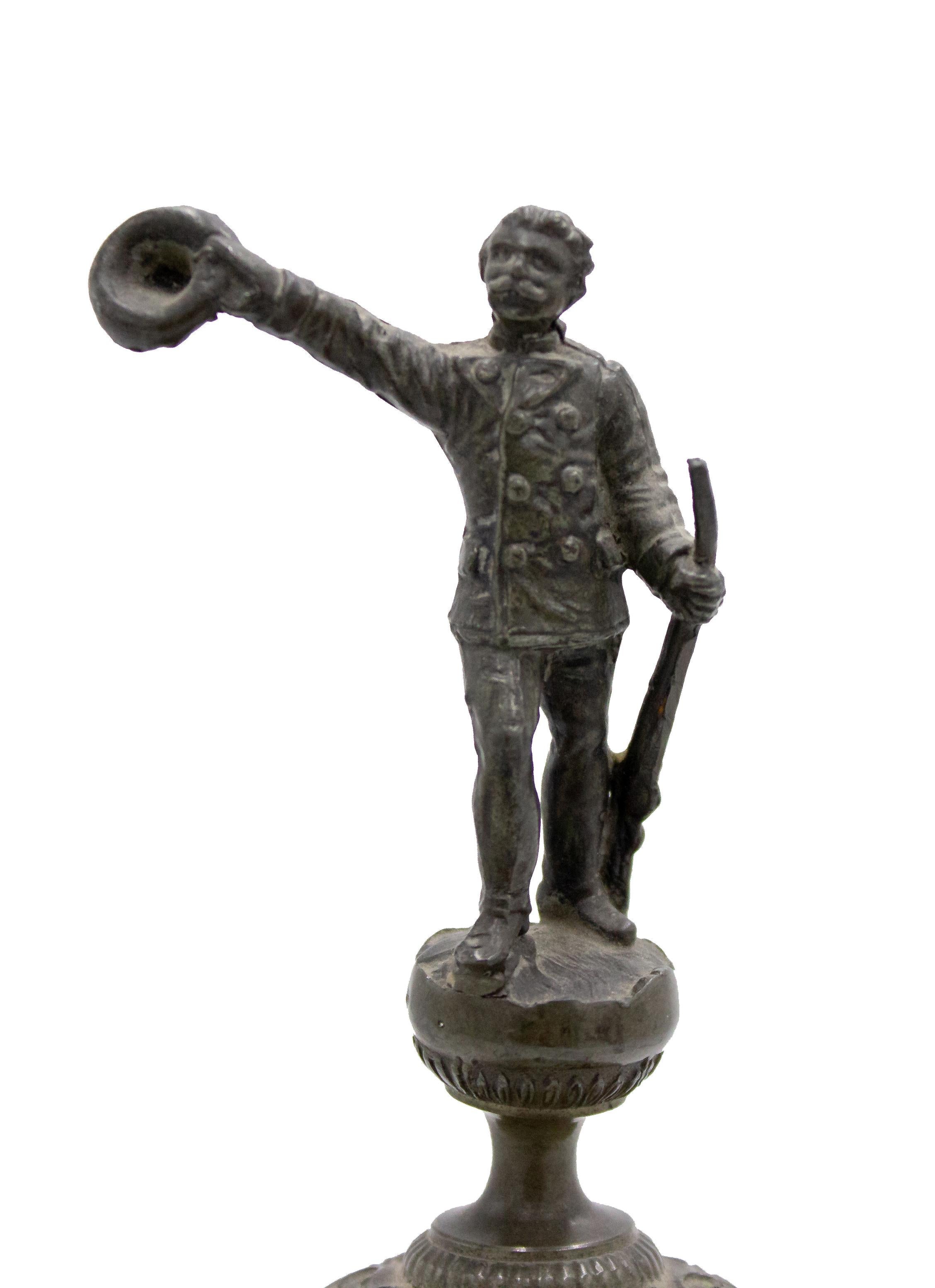 English Renaissance-style (19th Century) pewter chalice with hunter and gun relief and finial on lid.
 