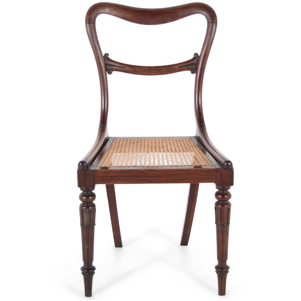 A set of four elegant early-Victorian solid Brazilian rosewood-framed cane-seated chairs, the backs of early ‘balloon back’ form, the turned tapering front legs with acanthus leave carved details.
English, circa 1840.


 