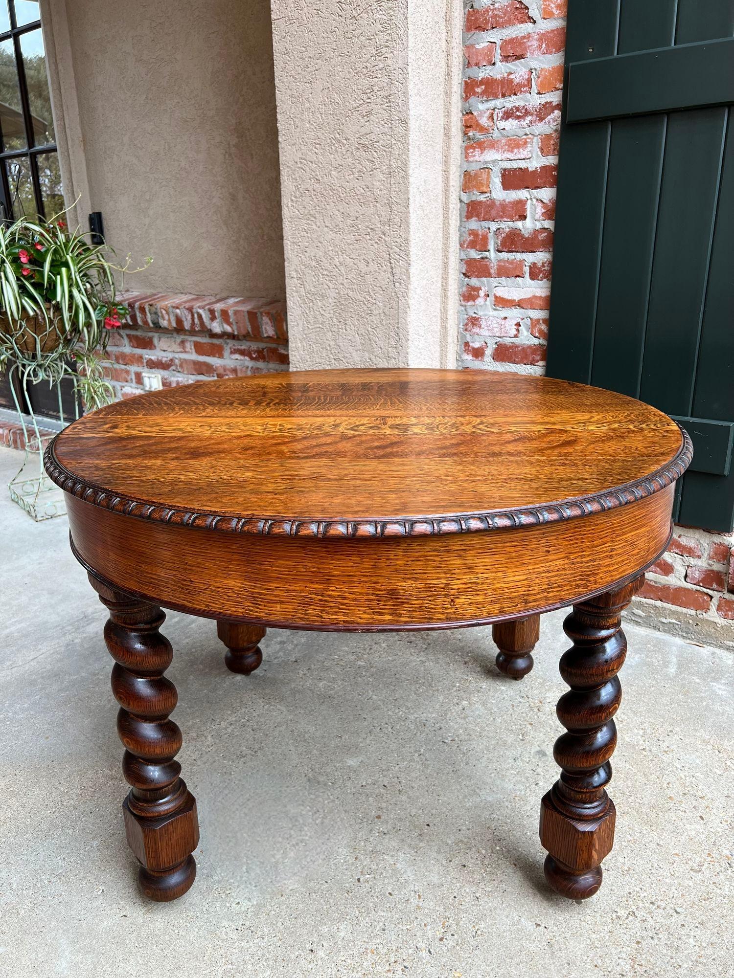 19th Century English round dining center table barley twist carved tiger oak.

 Direct from England, a beautiful round antique dining or center table! The round top features outstanding tiger oak grain and a large, beveled edge over the extra wide