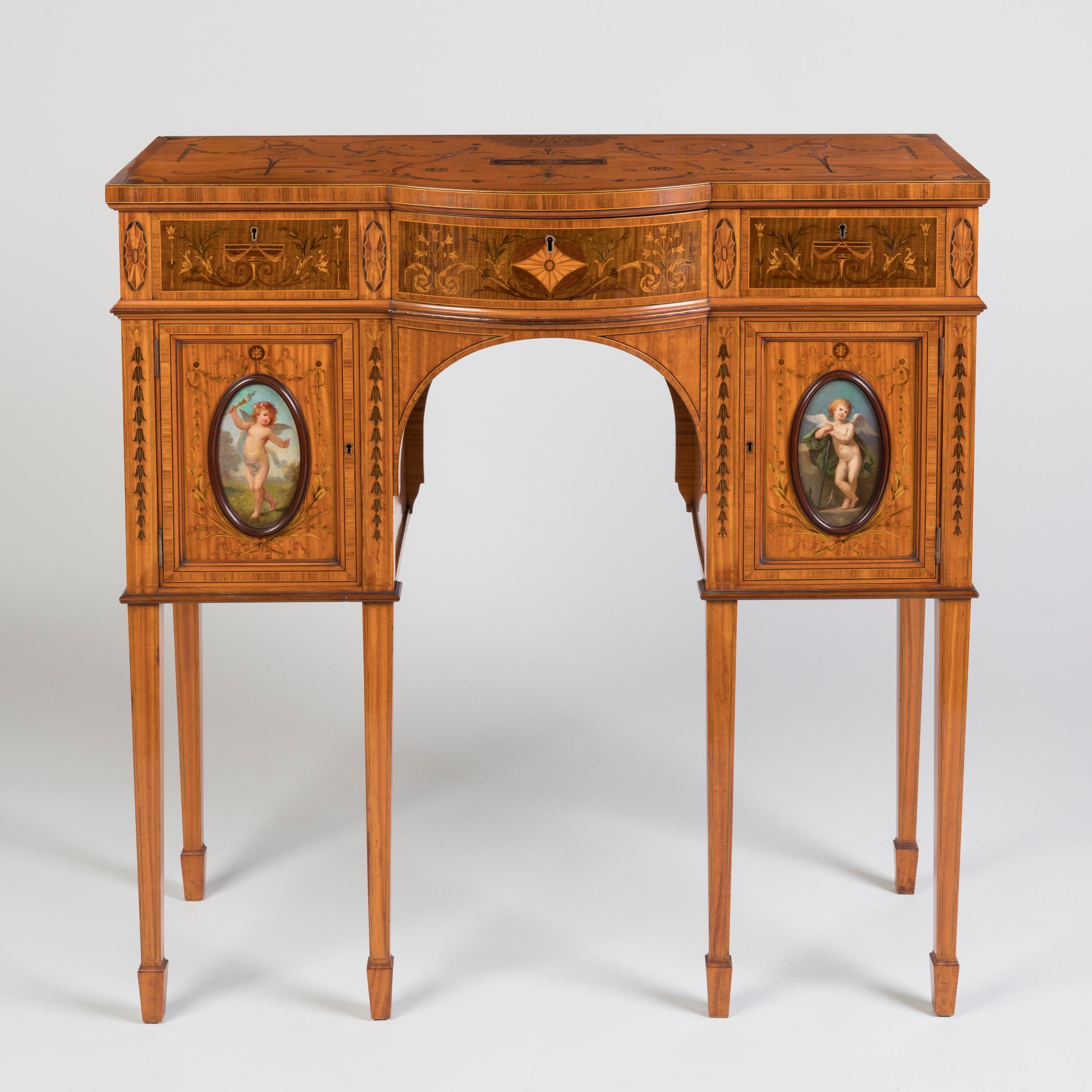 A Fine Satinwood Console Table
Attributed to Wright and Mansfield

A superb example of the neoclassical revival attributed to the esteemed makers Wright and Mansfield, this console table is crafted in satinwood, having a shaped top intricately