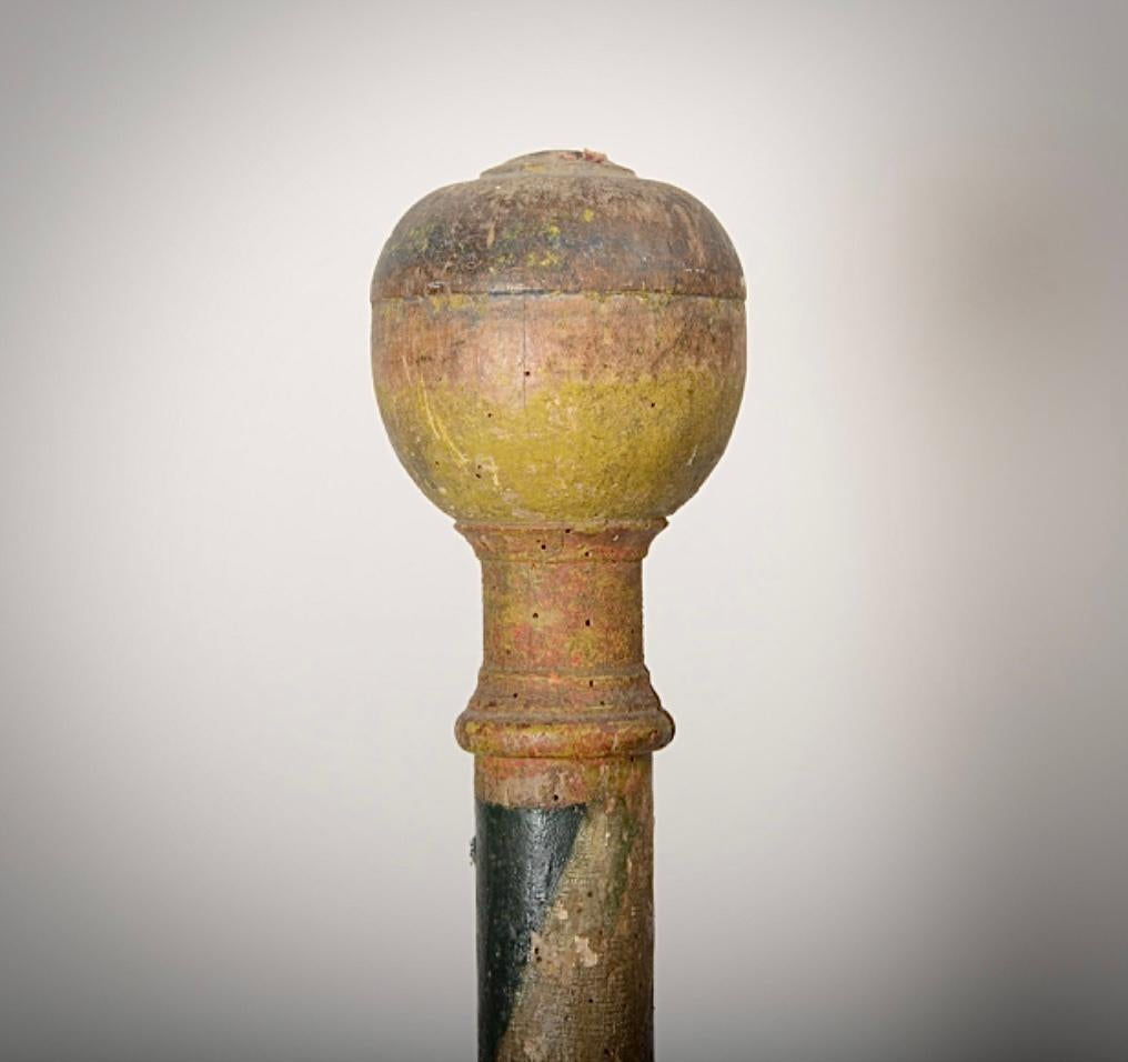 A fine and rare early barbers pole in original polychrome paint finish. Turned in one piece.
A decorative and original piece of folk art. The white was for bandages, red for blood and blue for veins. These were all services offered by barbers at the