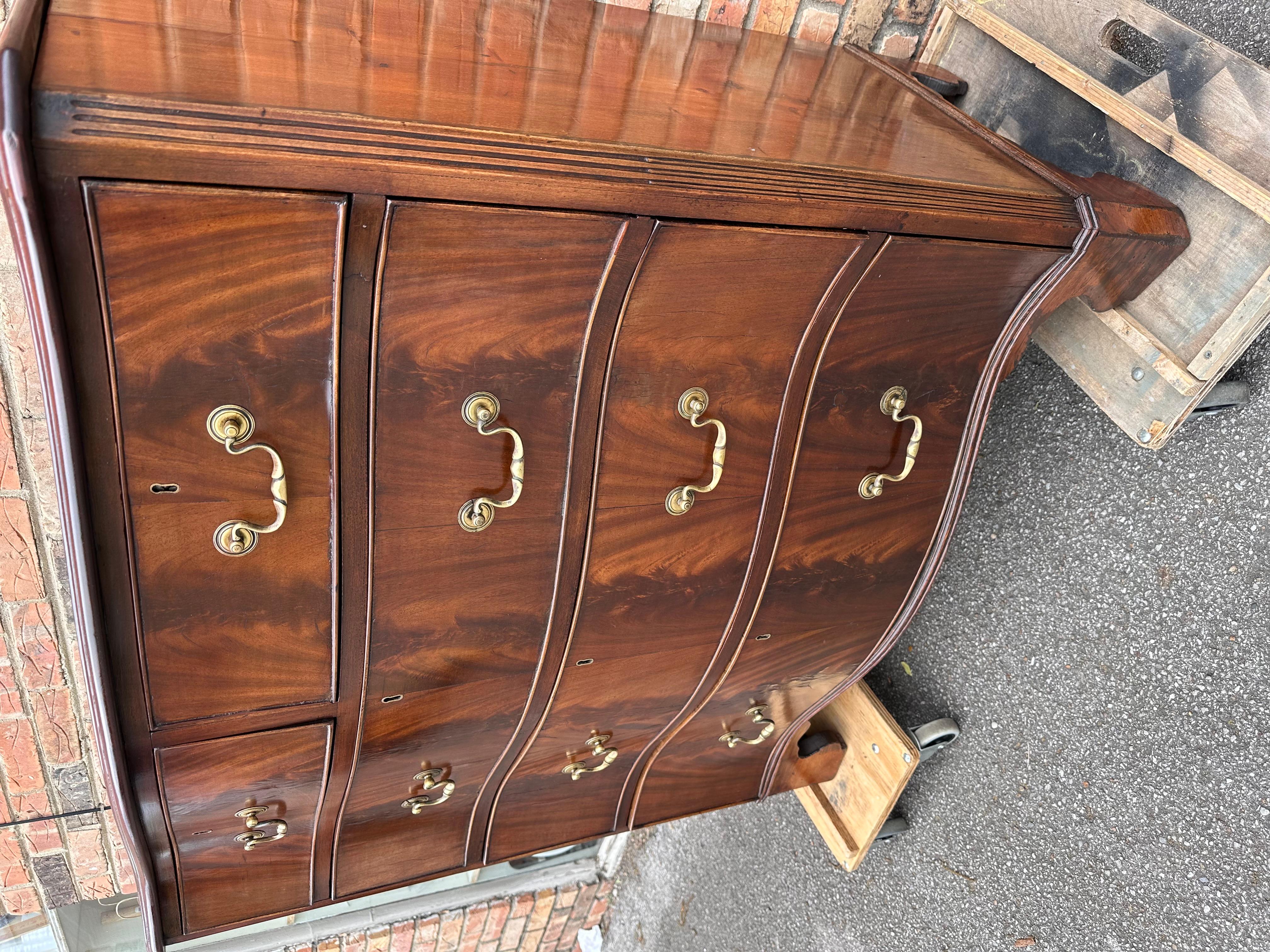 This is a beautiful mid 19th century English serpentine front chest. The wood Is a flamed mahogany, and it is flamed! In this business we don't see too many serpentine front chest mainly bowfront are flat front the opportunity to own one of these
