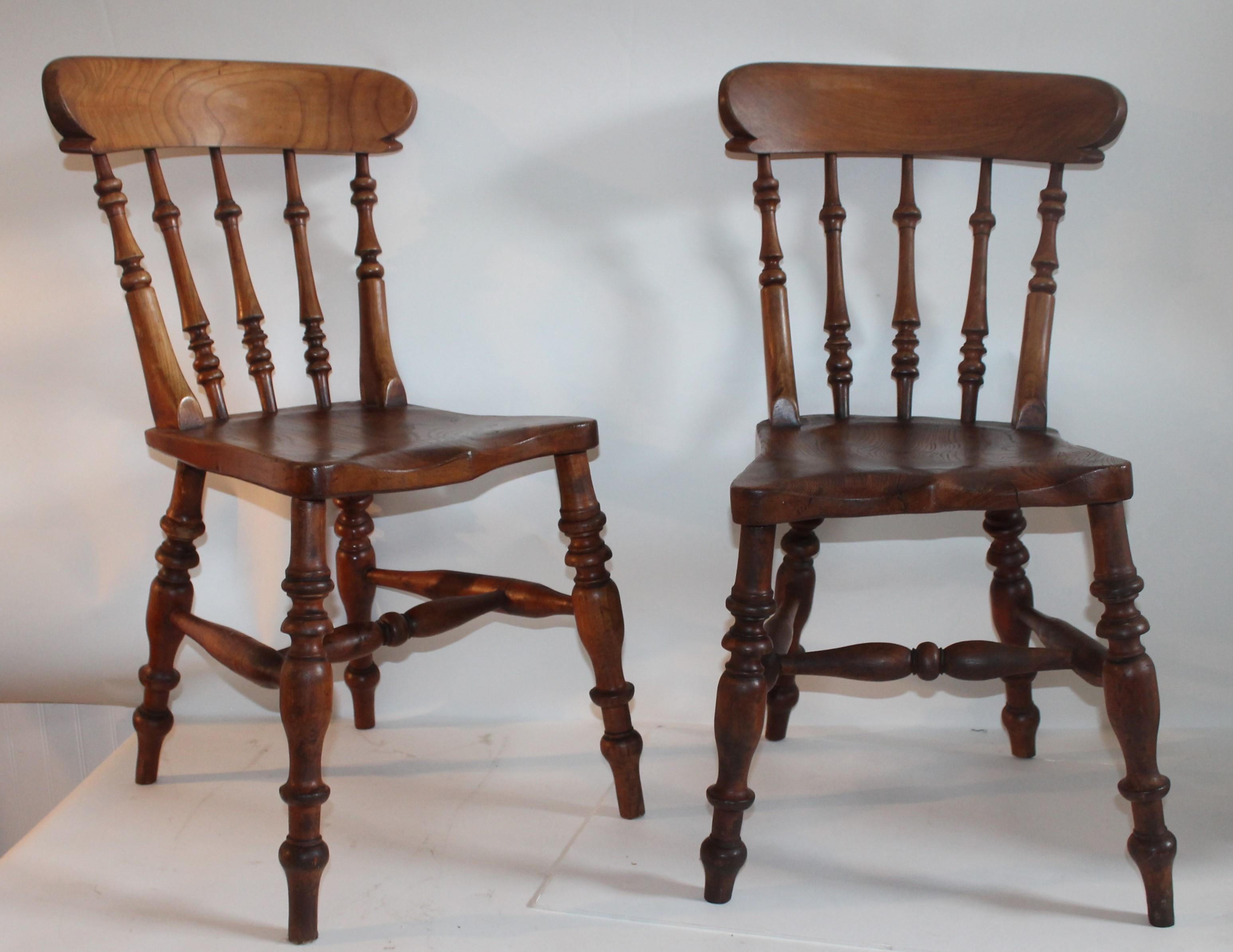Pair of 19th century English pub side chairs. These chairs are super comfortable and sturdy.