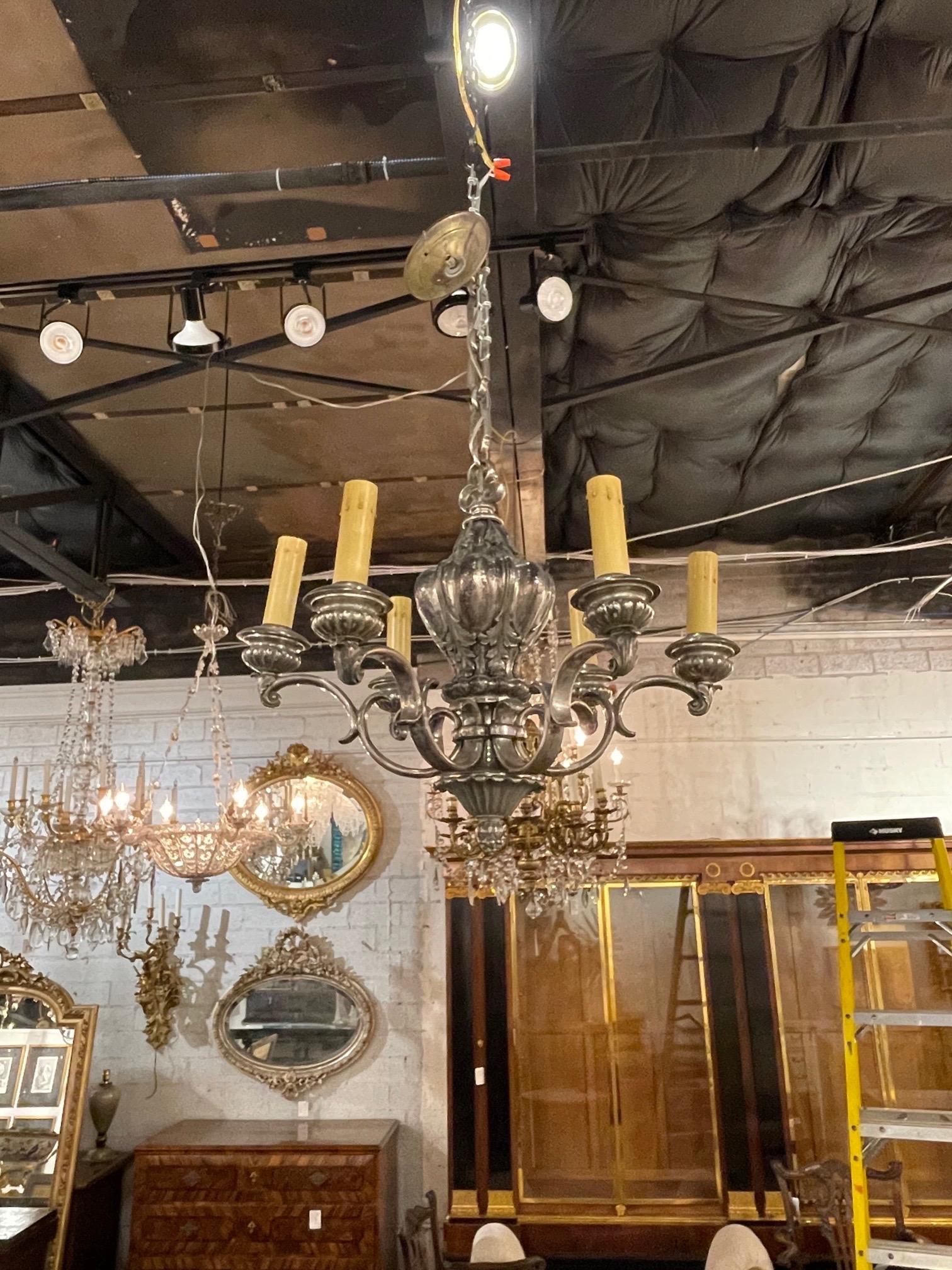Lovely 19th century English silver plate 6-light chandelier. Beautiful decorative details on the base and arms. Makes an elegant statement!