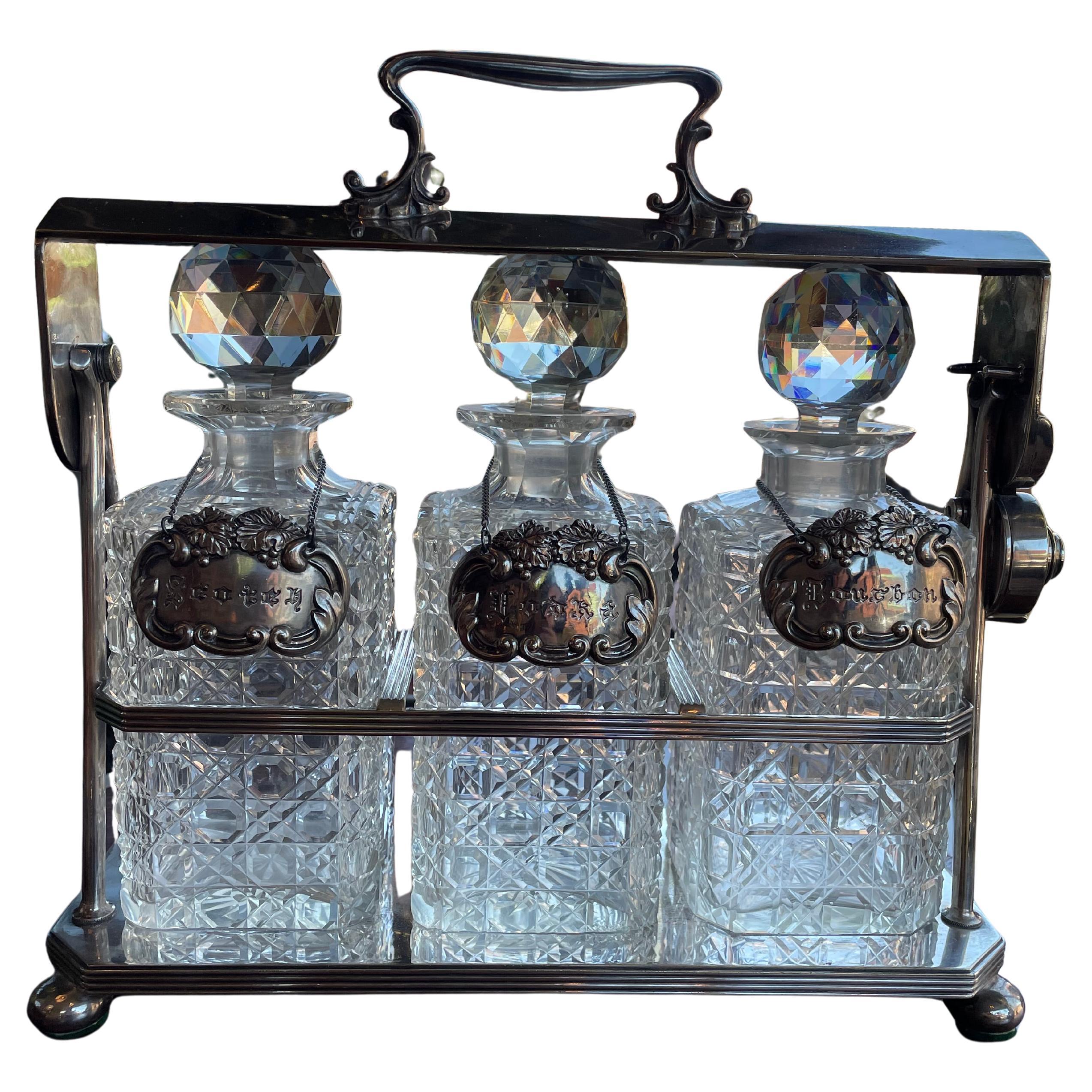 19th Century English Silver Plated Three Carafe Tantalus with Lock Mechanism