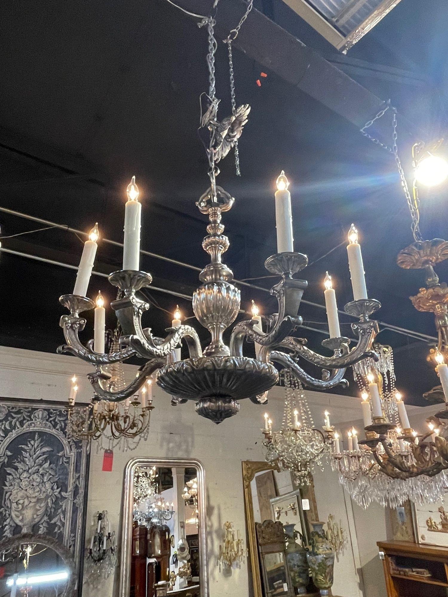 Exceptional 19th century English silvered bronze chandelier with 8 lights. Gorgeous scale and shape to this piece. A traditional beauty for a fine home!