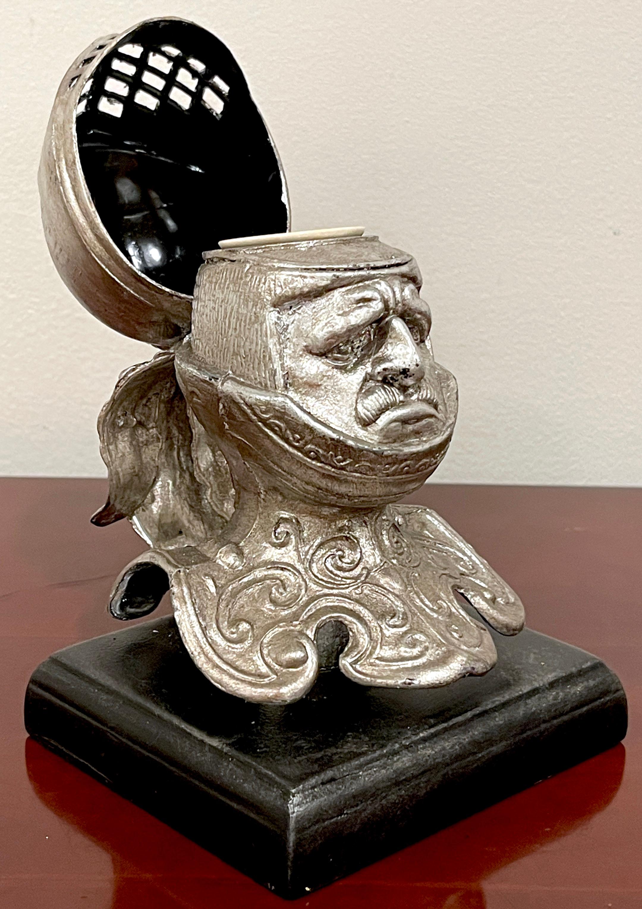 19th Century English Silvered Metal 'Worried Knight' Inkwell

Add a touch of classical whimsy to your home or office with our tole figural knight inkwell. Made in later 19th century England, this charming piece is adorned with an expressive knight