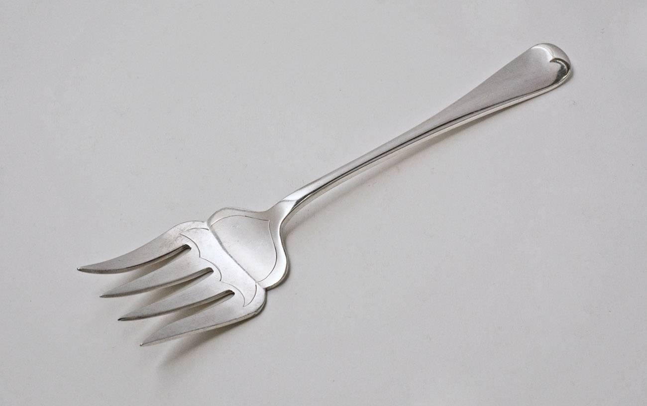 The 19th century silver plated serving fork is English, stamped G. Ibberson & Co. Also stamped EPNS for electroplated nickel silver. The handle has a classic 18th century design.