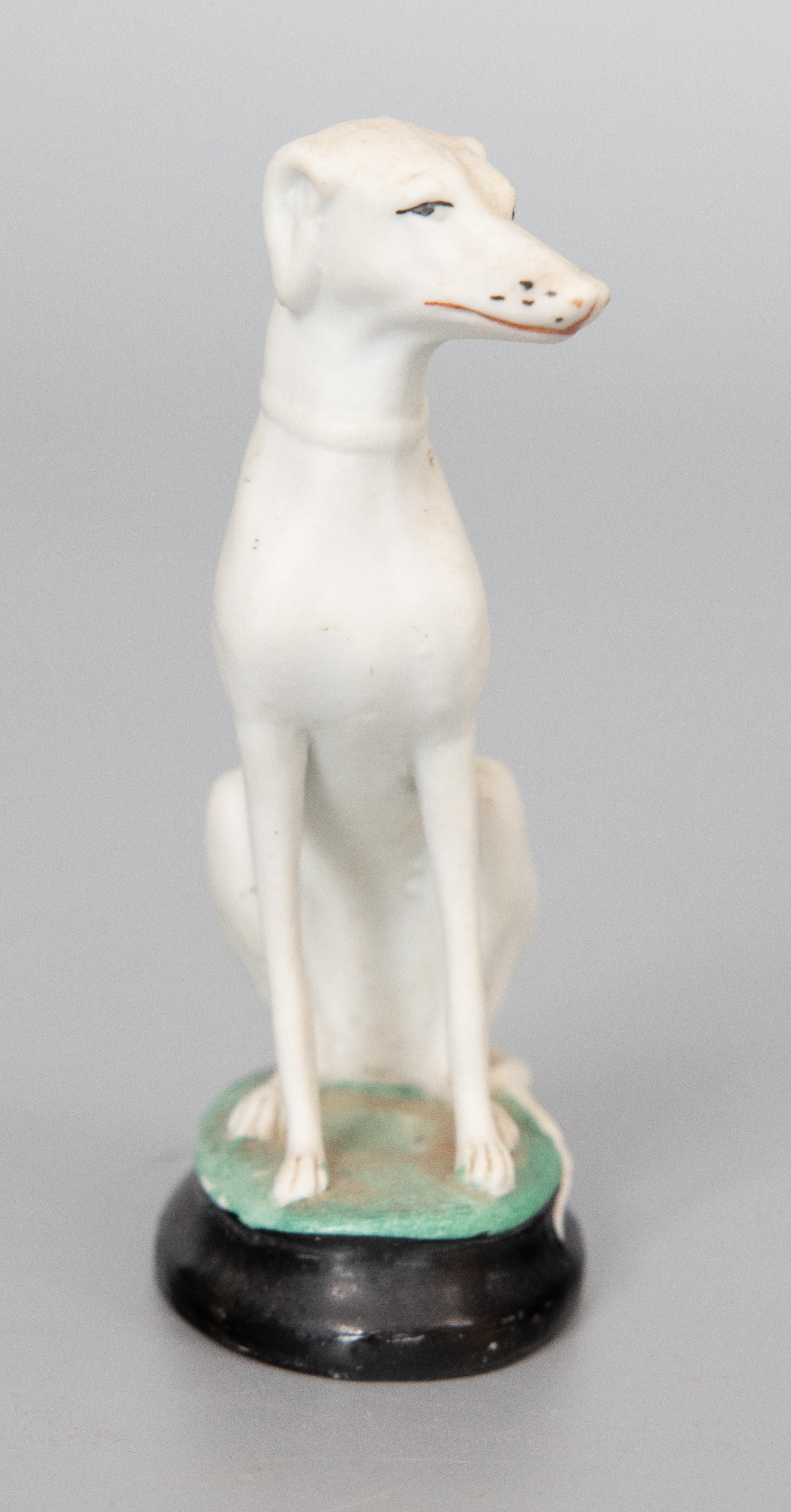 A superb antique 19th-Century English Staffordshire bisque Whippet / Greyhound dog figurine. This fine fellow is hand painted with exquisite details and would be perfect for the dog lover or collector.

DIMENSIONS
2
