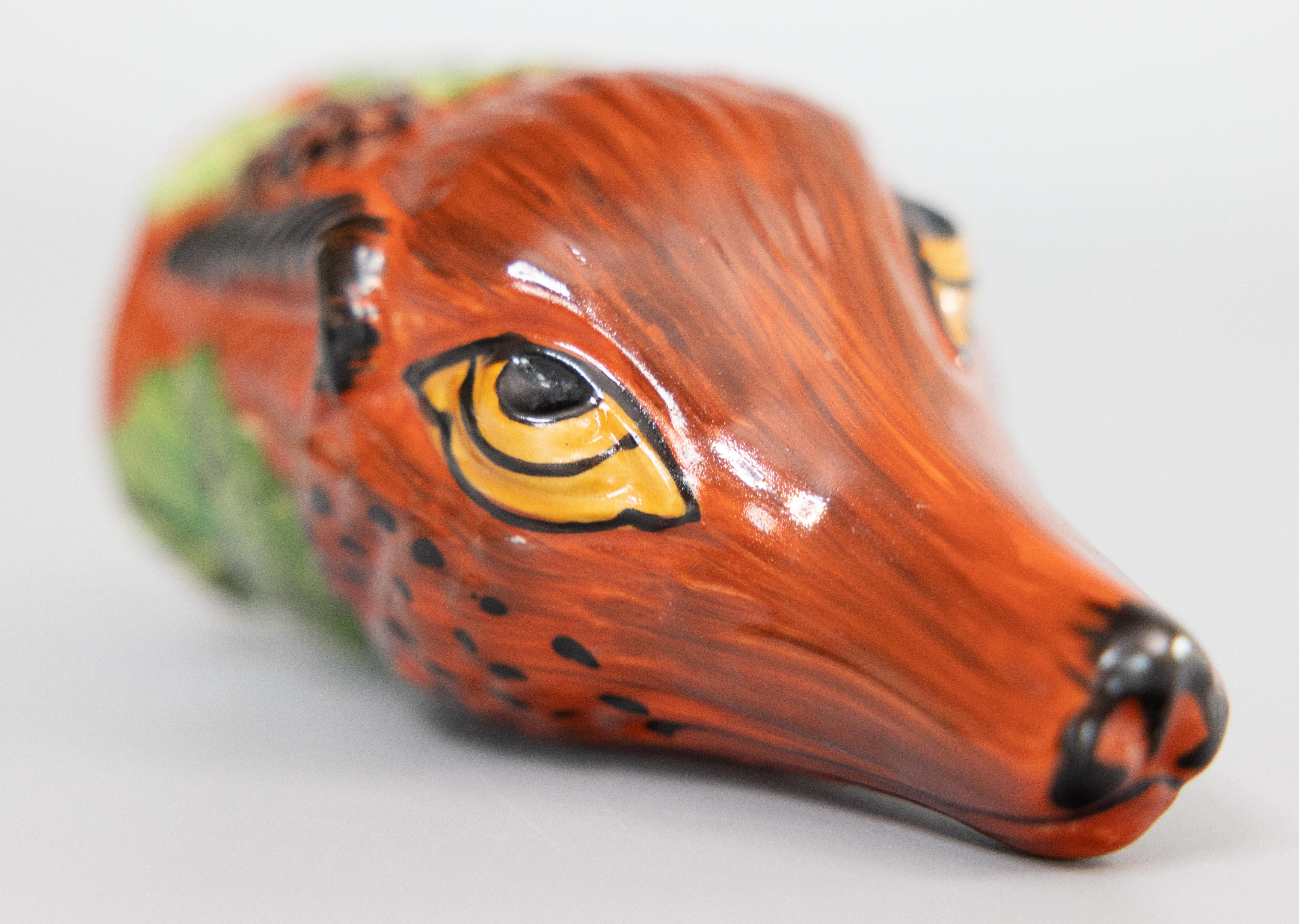 A fine 19th century English Staffordshire fox hunting stirrup cup. This charming stirrup cup is in the form of a fox head and hand painted with beautiful details. It's perfect for the collector and would also make a wonderful gift for the equestrian