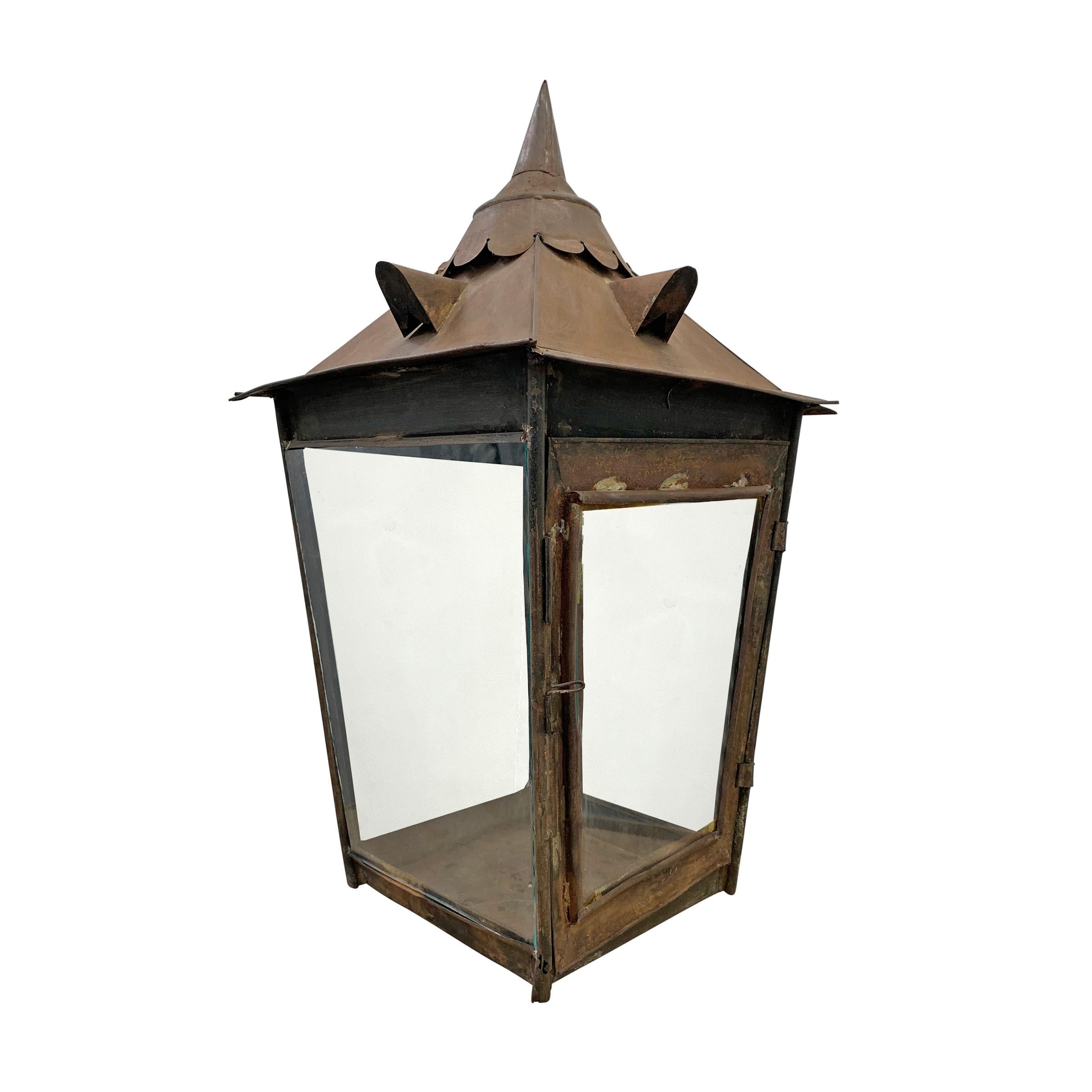 A wonderful 19th century English tole street lamp with four glass sides, and an architectural gabled roof inspired top. This would originally have been on a post, and piped for gas, but today it's perfect for use on a table top, indoors or out, with