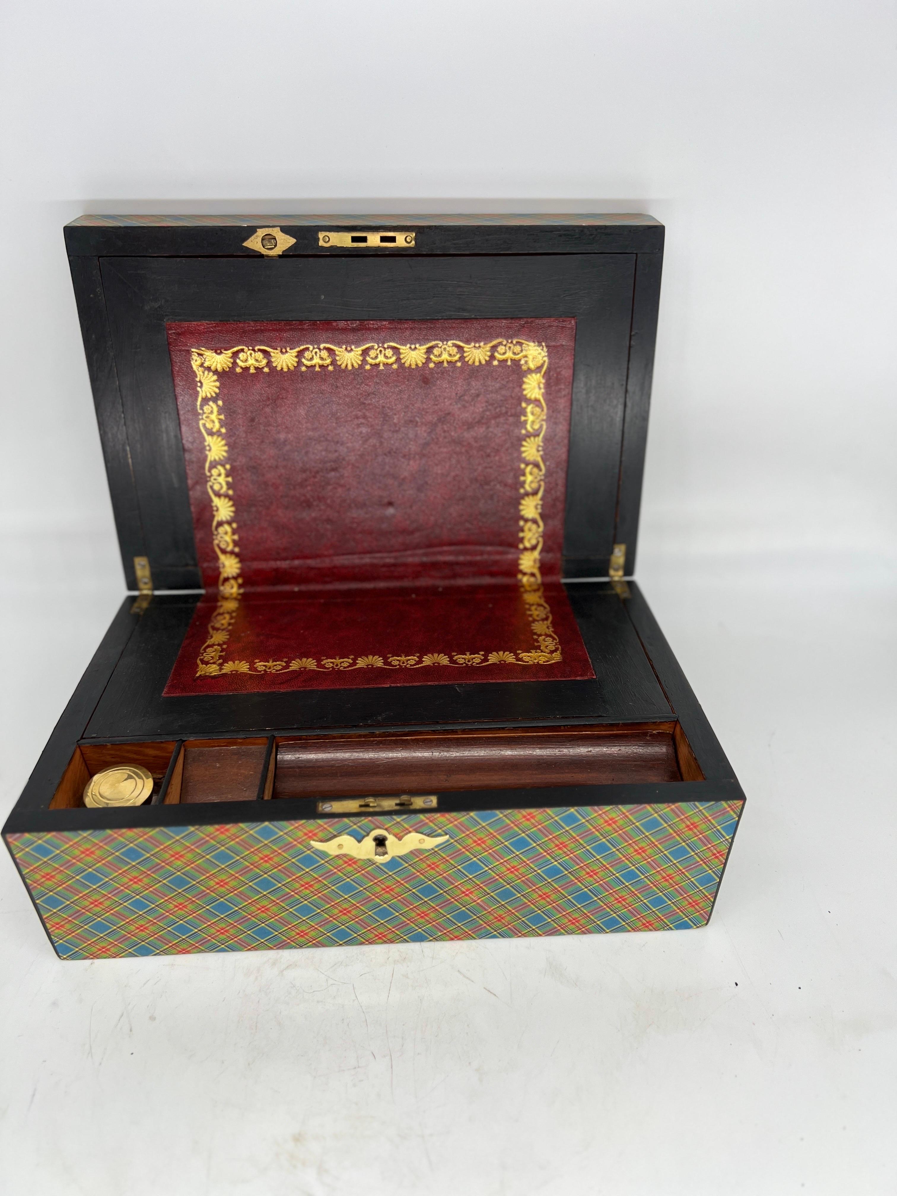 English with Scottish influence, 19th century. 

A fine quality antique 19th century lap desk constructed with a mahogany frame which has been wrapped in Scottish Tartan paper. The interior has a beautiful period embossed leather 