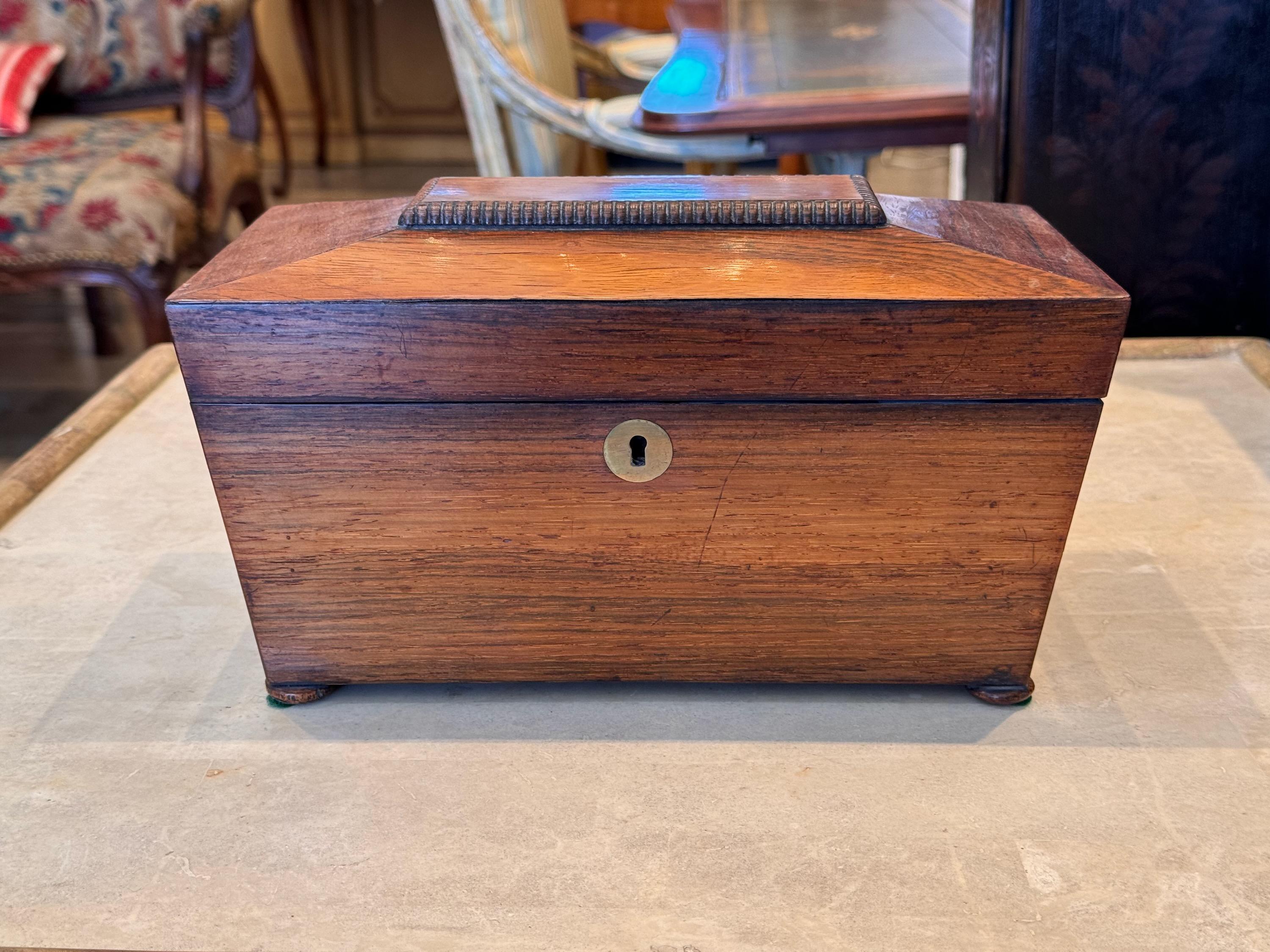 This is a nice size tea caddy. It has great color.. Brass inlay escutcheon.