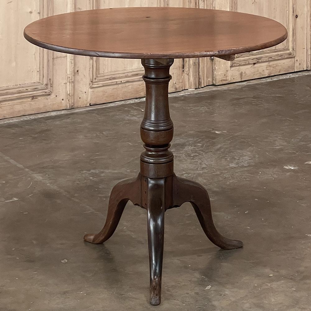 19th Century English Tilt-Top Walnut End Table is one of the earlier examples of the type, rendered from walnut obtained from the Continent.  A pair of rails were affixed to the bottom, with a doweled attachment to the pedestal below allowing the