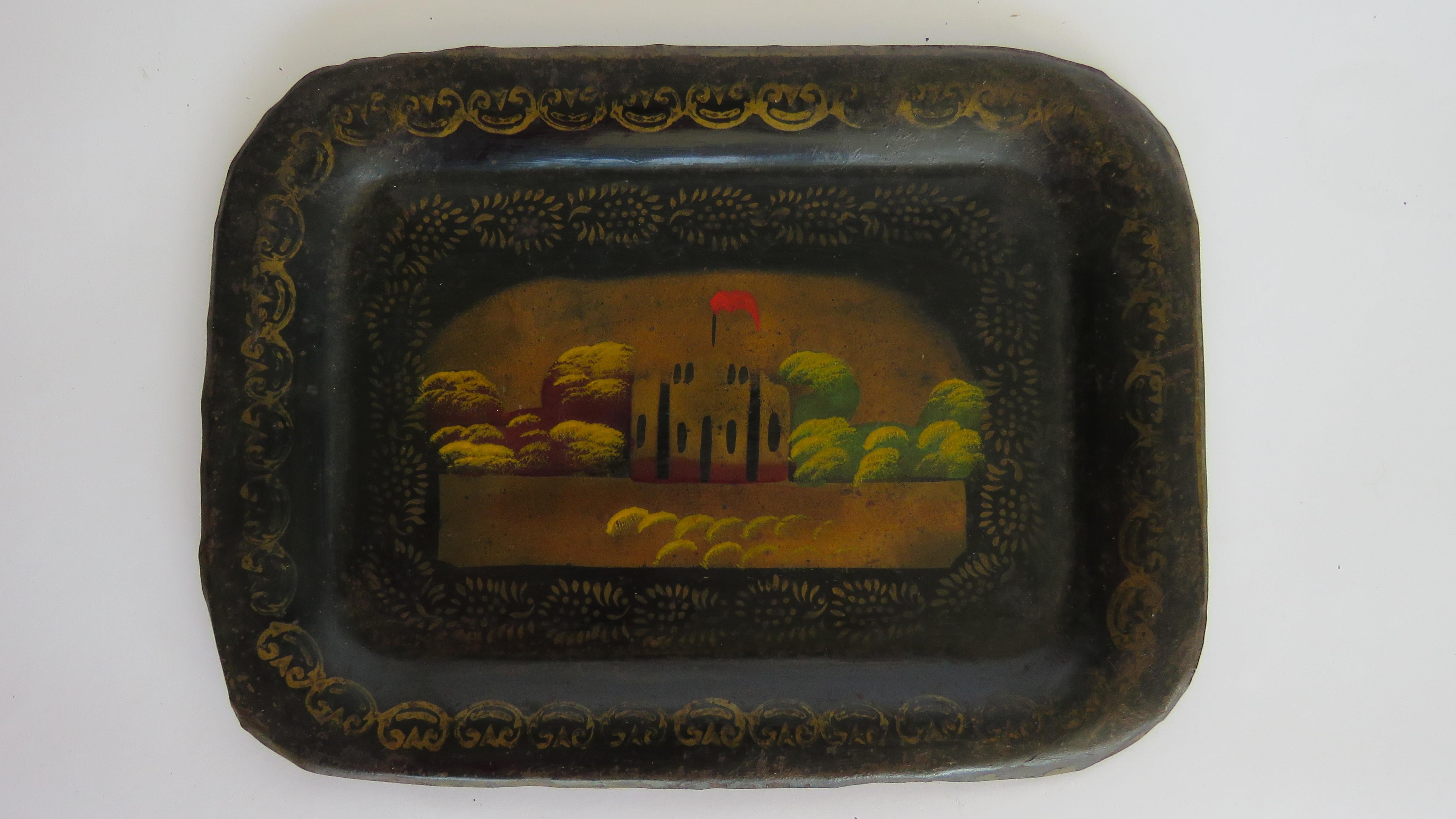 With hand painted scene of castle and Rococo bordering with lacquered finish.