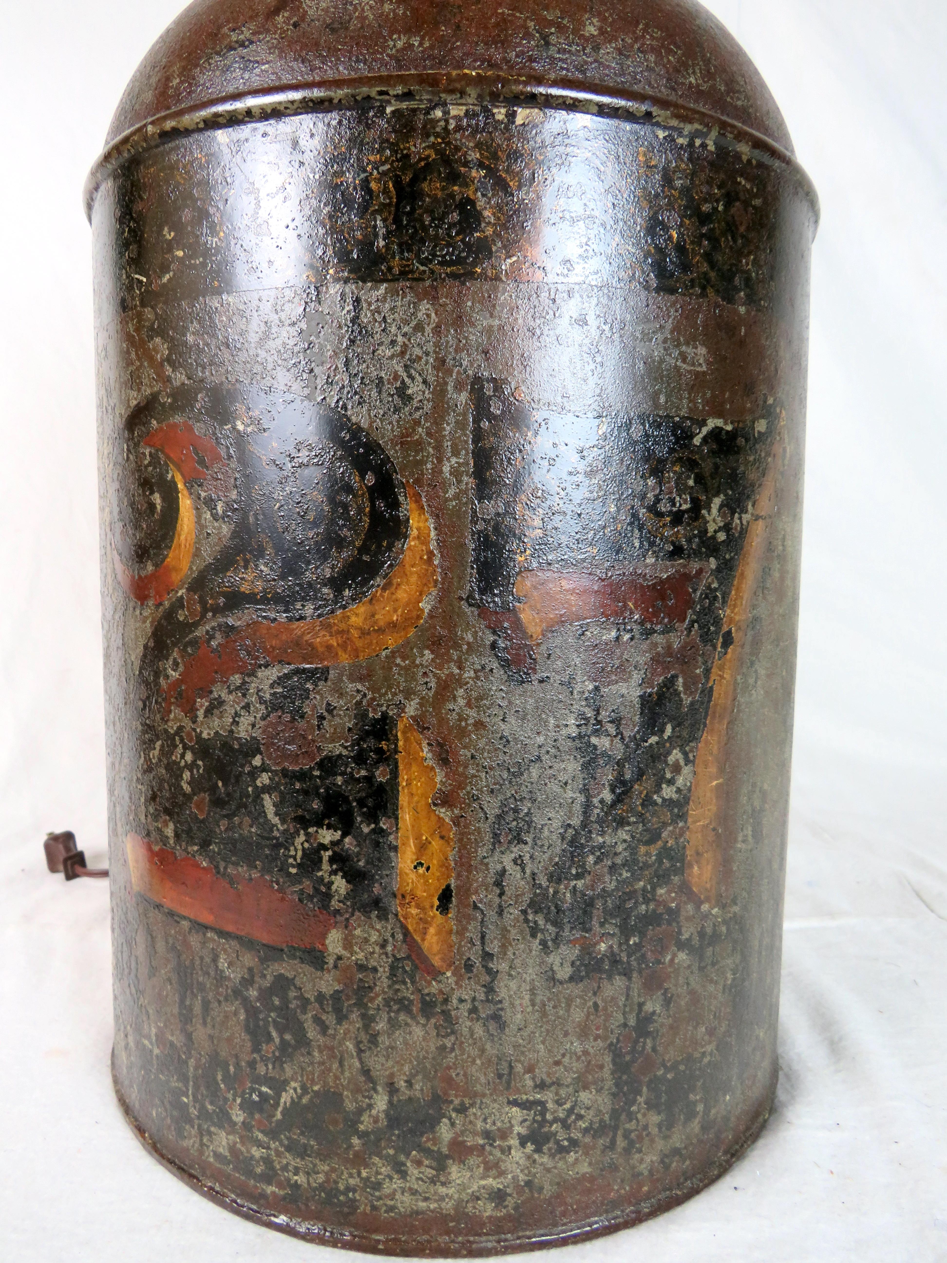 Mid 19th century English tole store tea caddy, fashioned into double socket lamp. Original polychromed paint decoration with black, red, and gilt decoration and numbered 