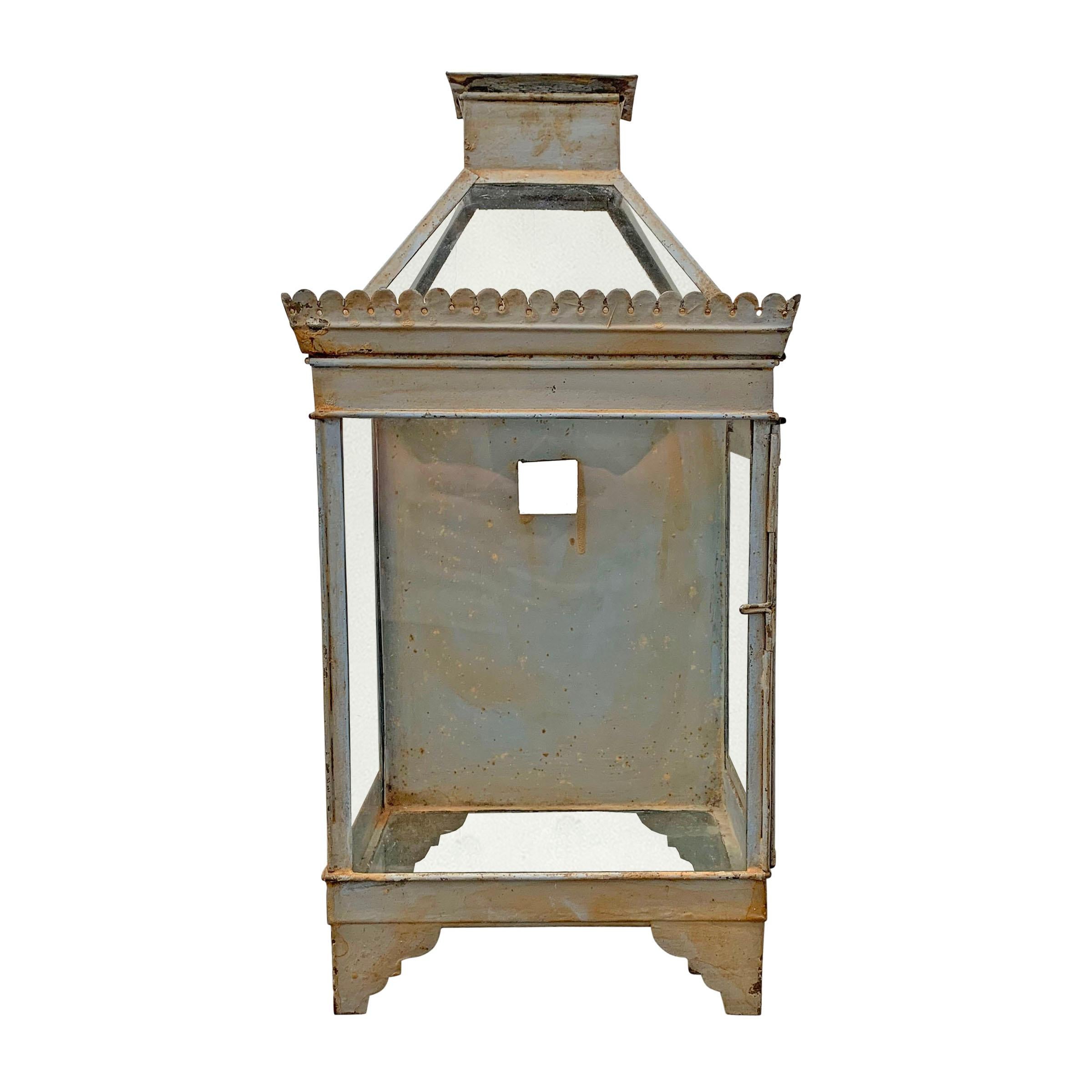 A charming 19th century English blue painted tole wall mount lantern of with a clearstory top that opens, and a door on the side that also opens for access. The square hole in the back was originally used to hang the lantern, but can be used to