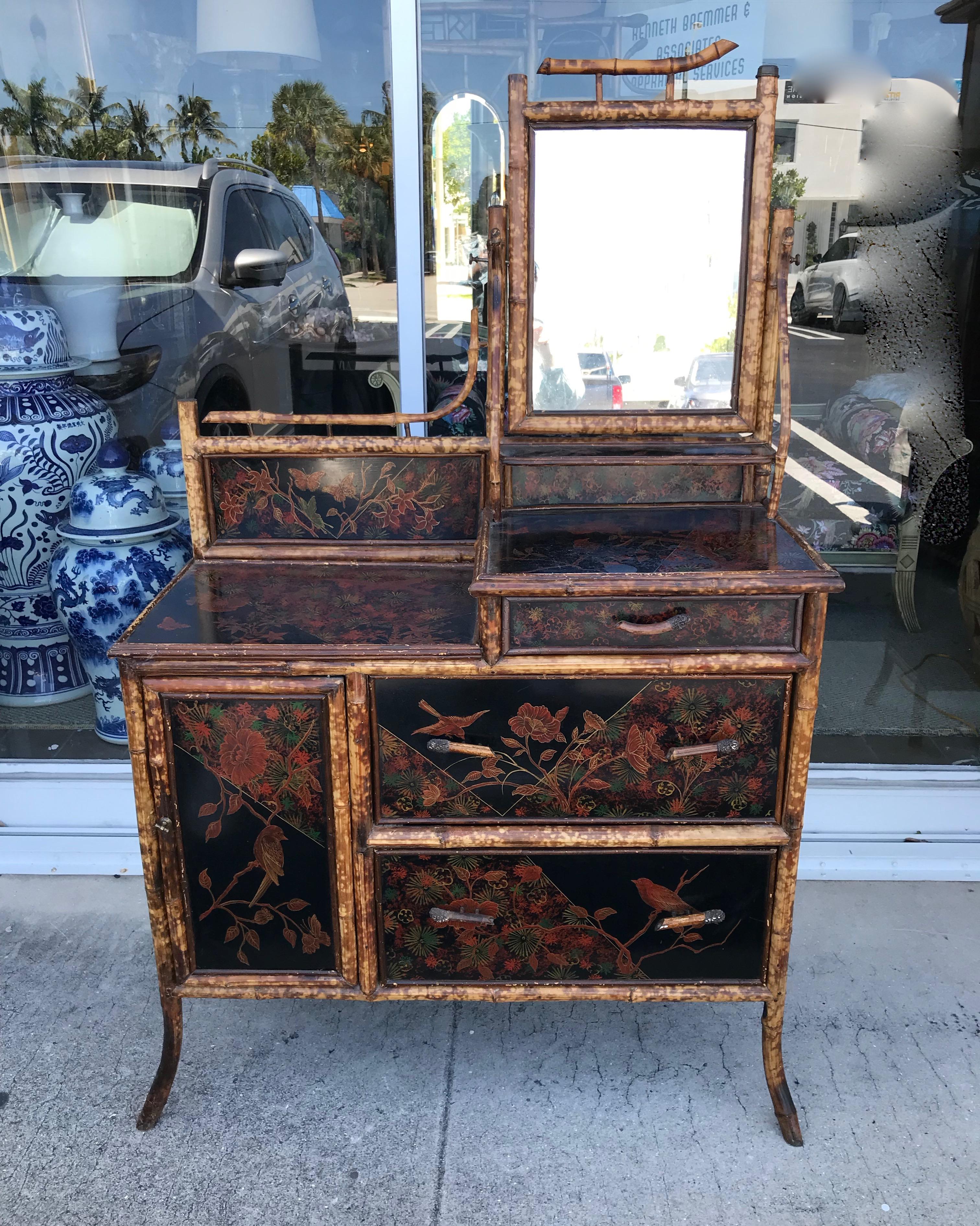 Unusual design, scale and form.
The dresser is dramatically and profusely decorated with figure of birds
and florals. It is exceptionally well detailed with unusual bamboo handles
and desirable 