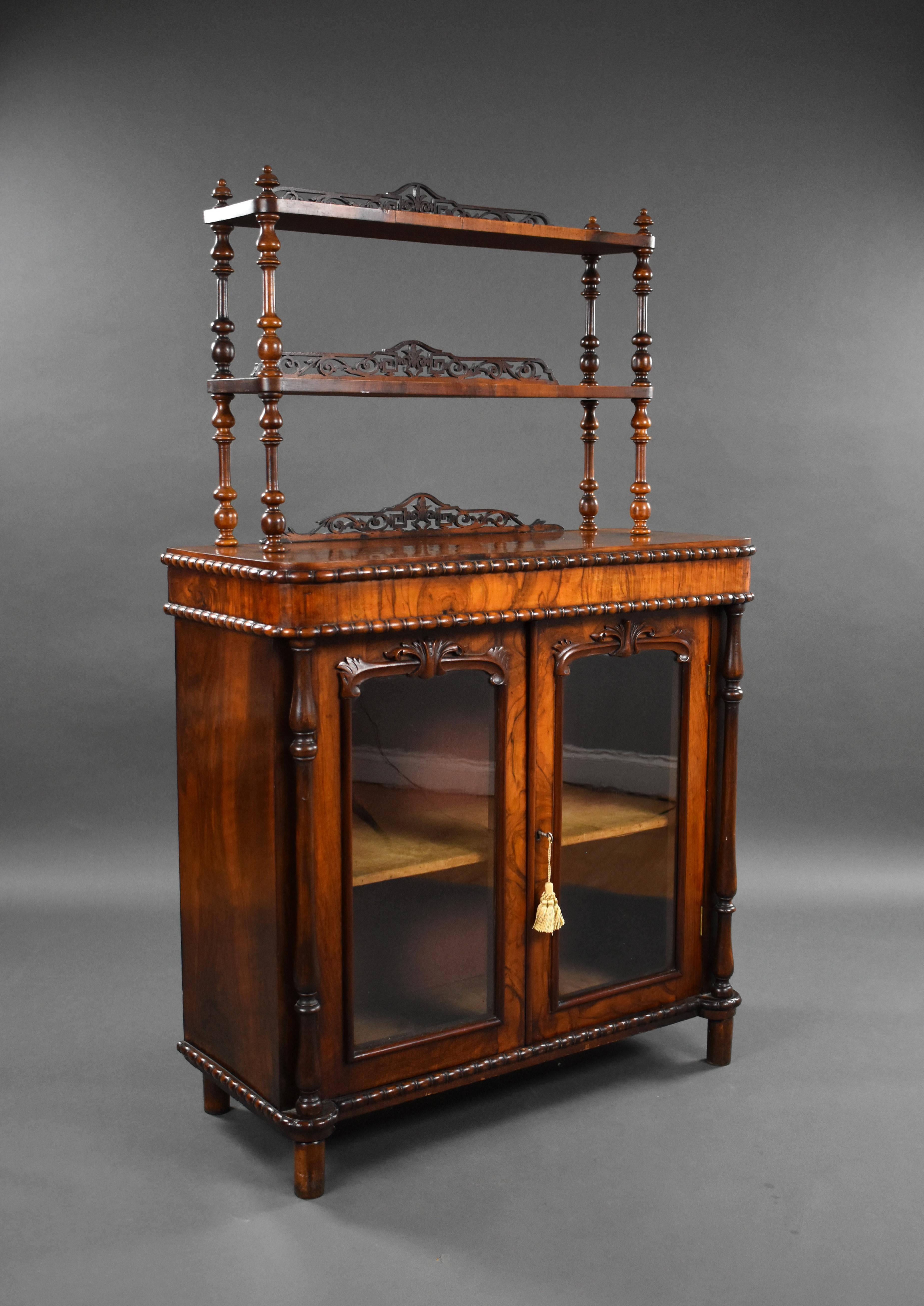 For sale is a good quality Victorian burr walnut chiffonier, having three shelves each with a pierced fret work gallery, above two glazed doors. The chiffonier remains in very good condition, showing light signs of wear commensurate with age and