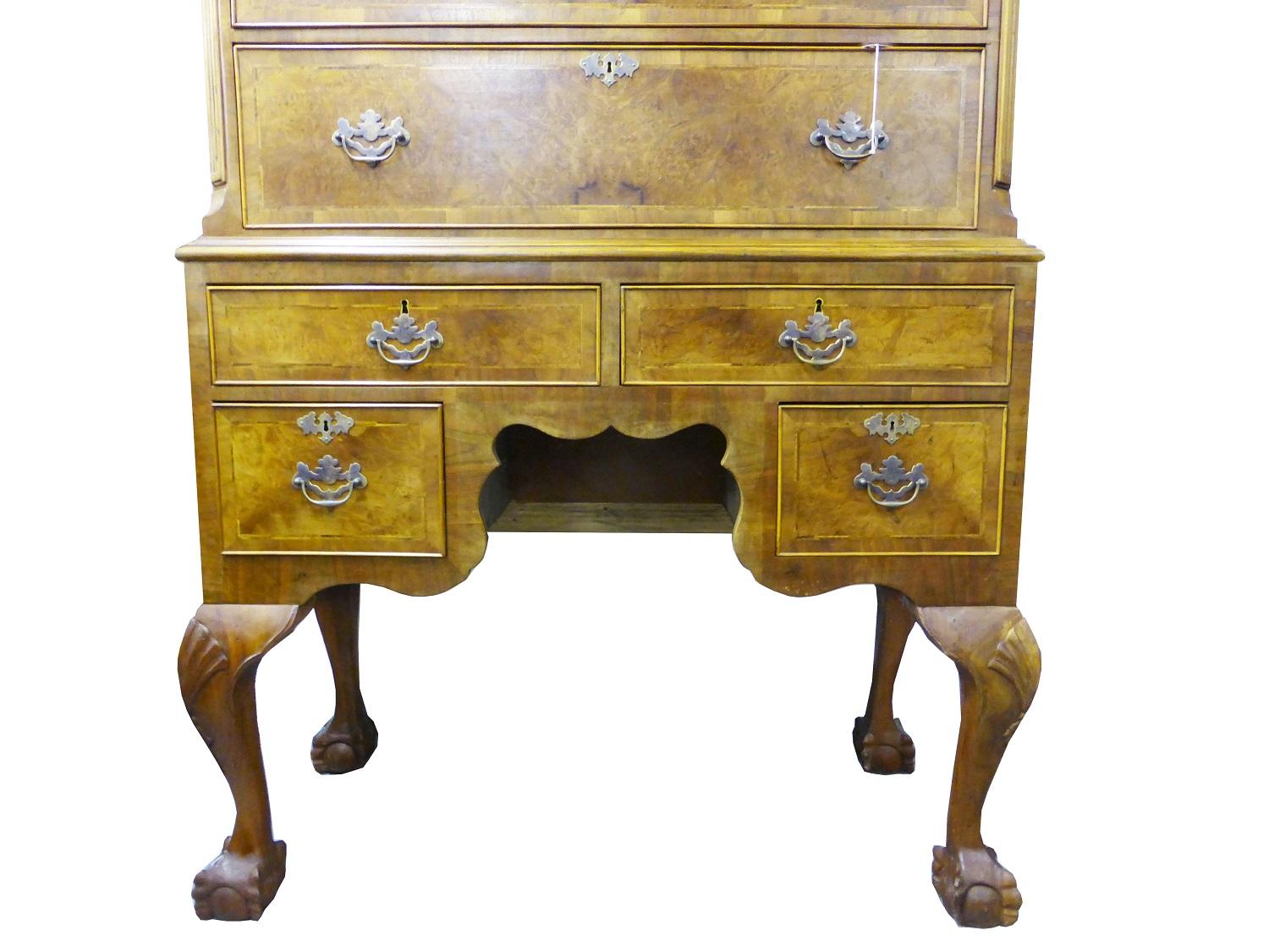 For sale is a good quality burr walnut chest on stand. The top of the chest has an arched pediment with a single drawer in the centre. Below this there are two short drawers over three long. The chest fits onto the base, comprising of a single long