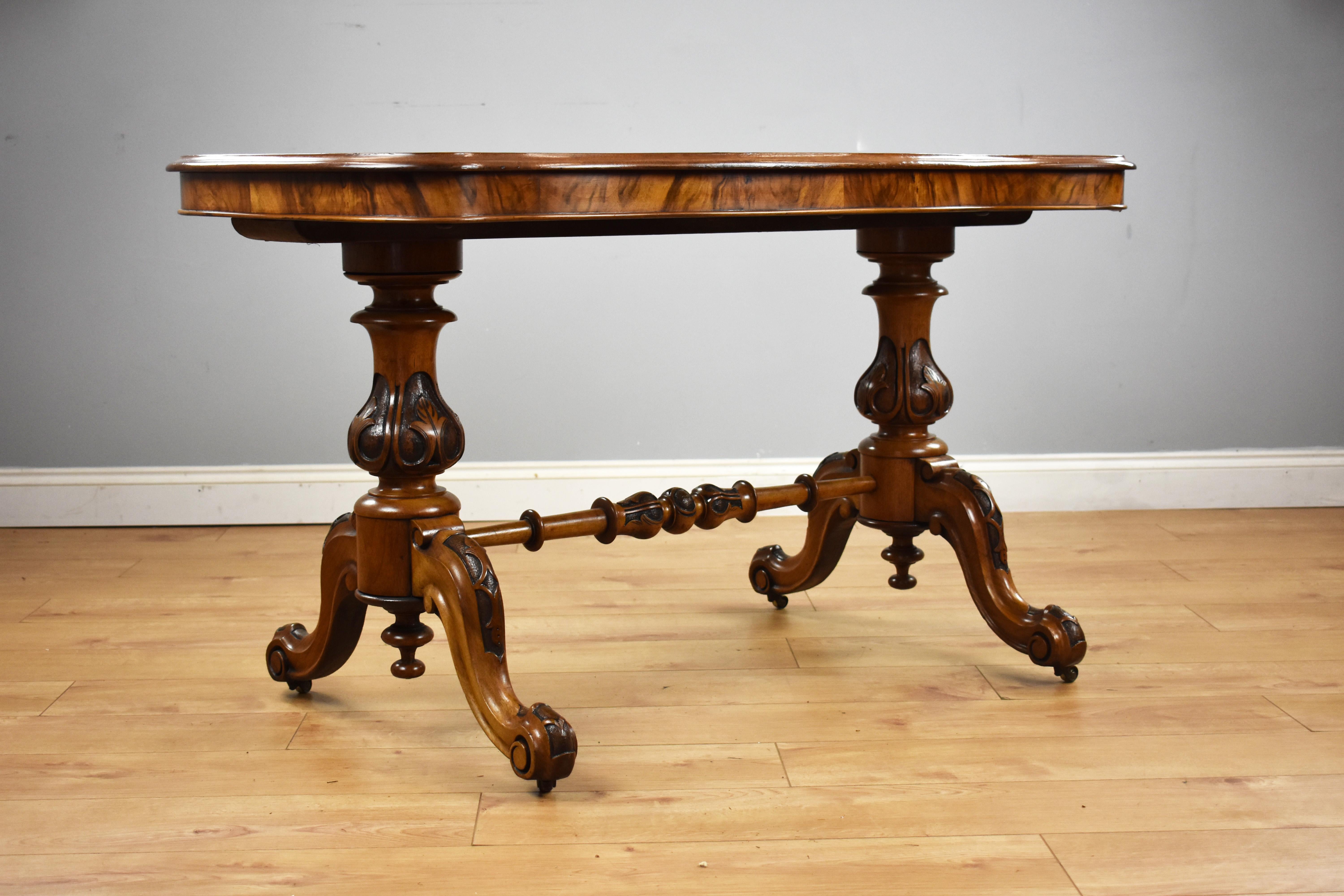 For sale is a good quality mid Victorian burr walnut stretcher table, being serpentine in form, it stands on elegantly turned and carved columns, united by a single turned stretcher. This piece is in very good condition for its age. 

Measures: