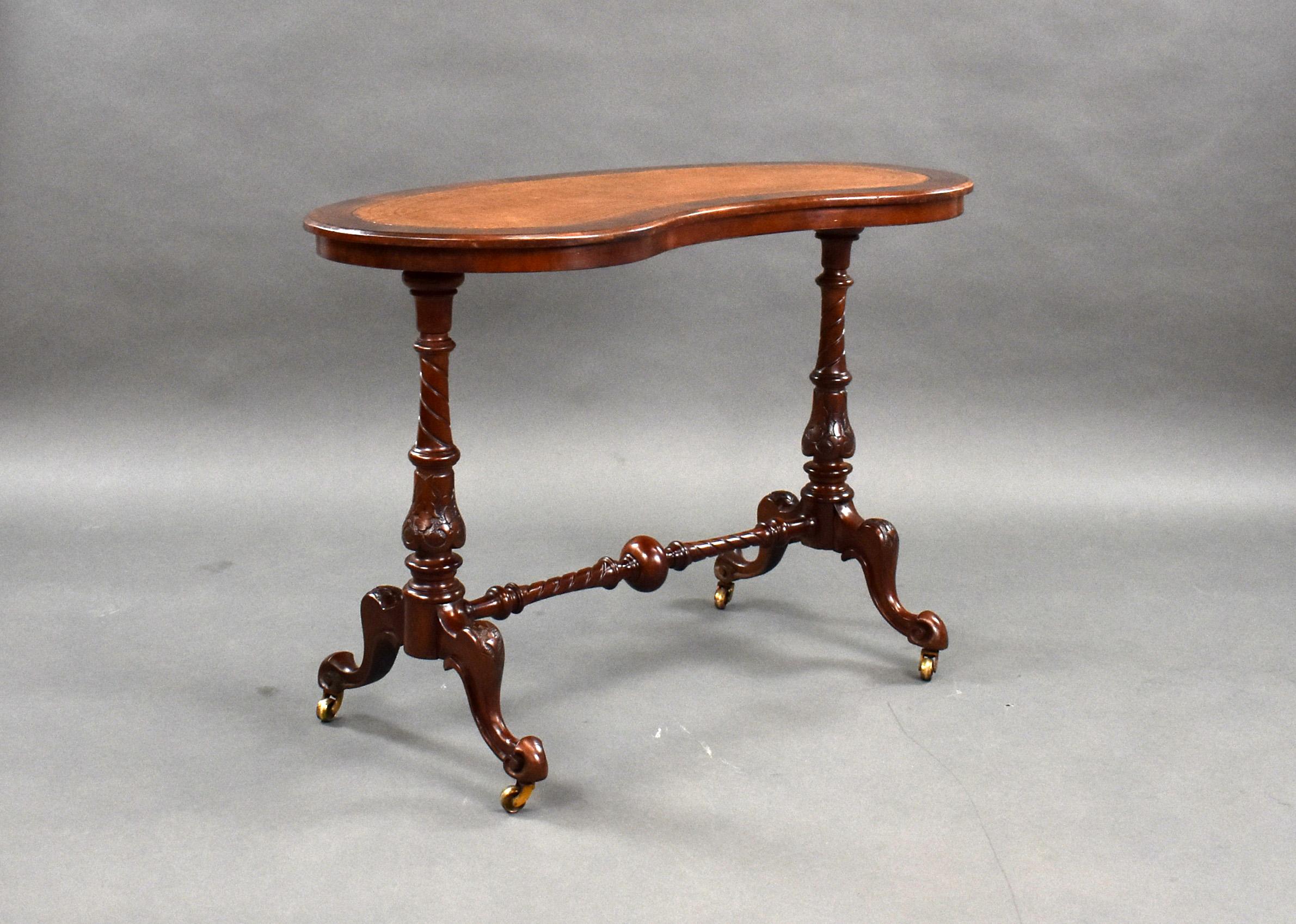 For sale is a good quality Victorian burr walnut writing table, having an inset leather top, with two turned and carved legs united by a central stretcher, standing on scroll feet raised on castors. This piece is in very good condition for its age.