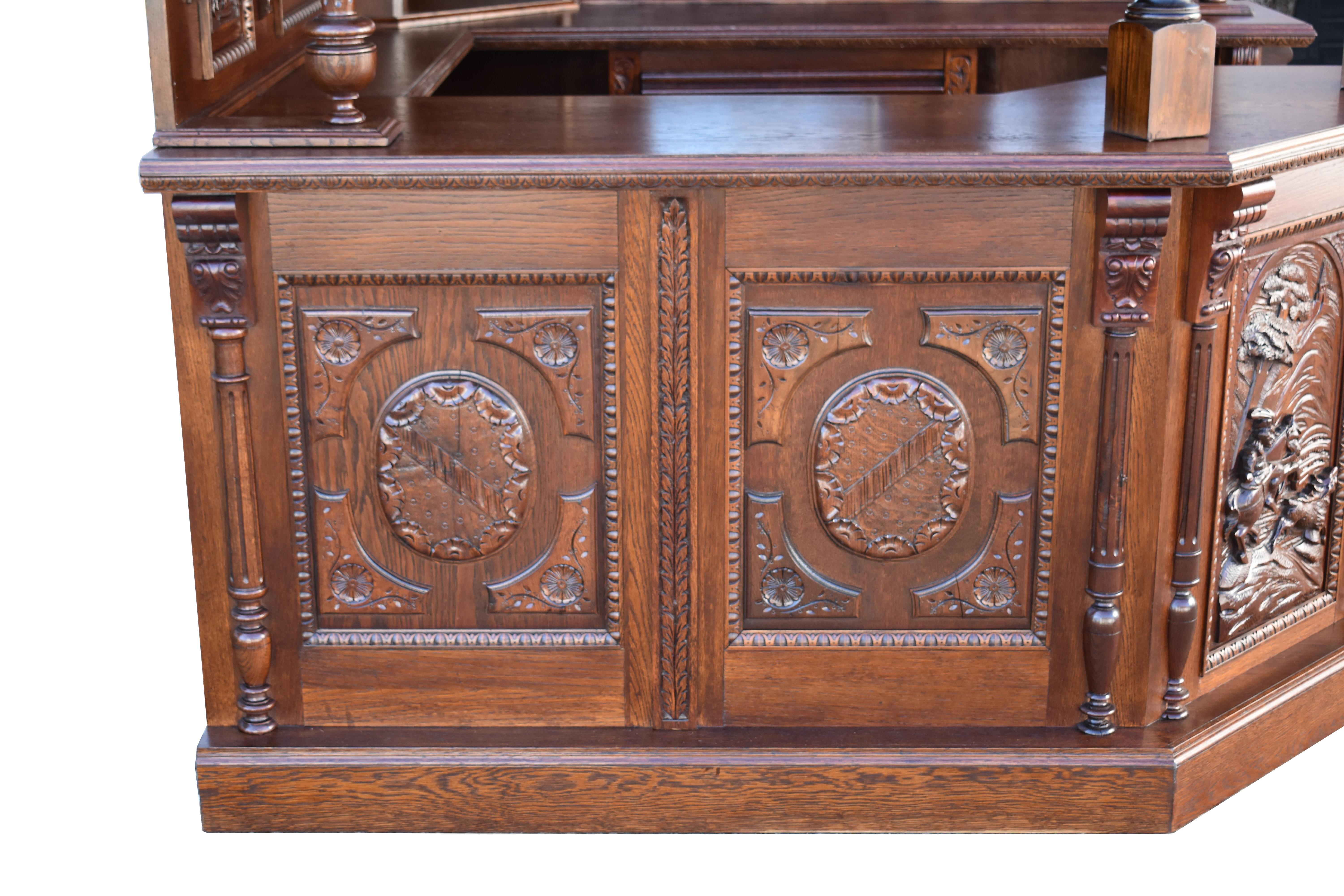 For sale is a Fine quality Victorian Carved Oak Canted Corner Bar, fully restored using as much antique timber as possible. Having ornate carved panels, engraved mirrors, and leaded glass, the bar is in excellent condition.