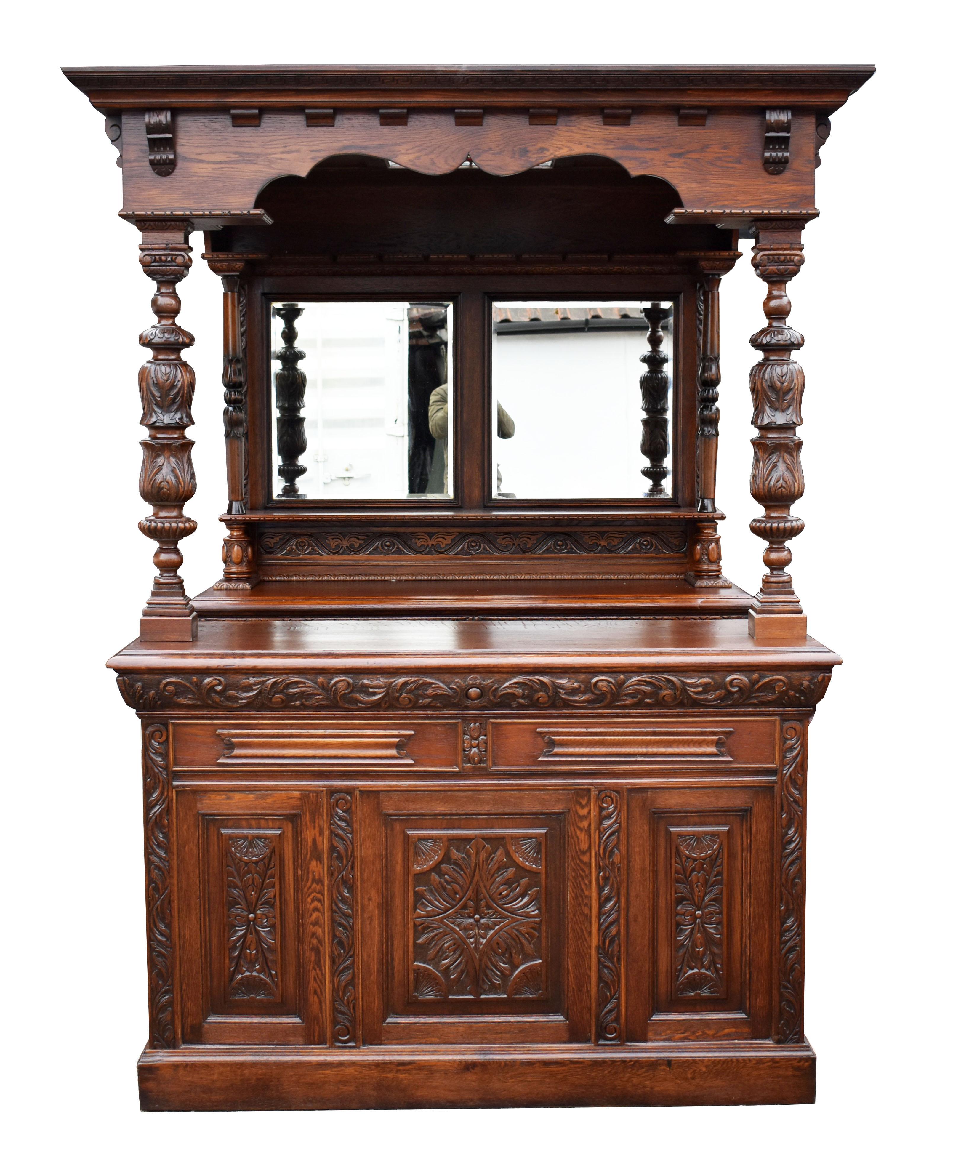 For sale is a good quality Victorian carved oak front and back bar, the canopy having a flared cornice also has a stained glass ceiling, supported by the mirror back, and ornate carved columns at the front. The back bar is fitted with two drawers
