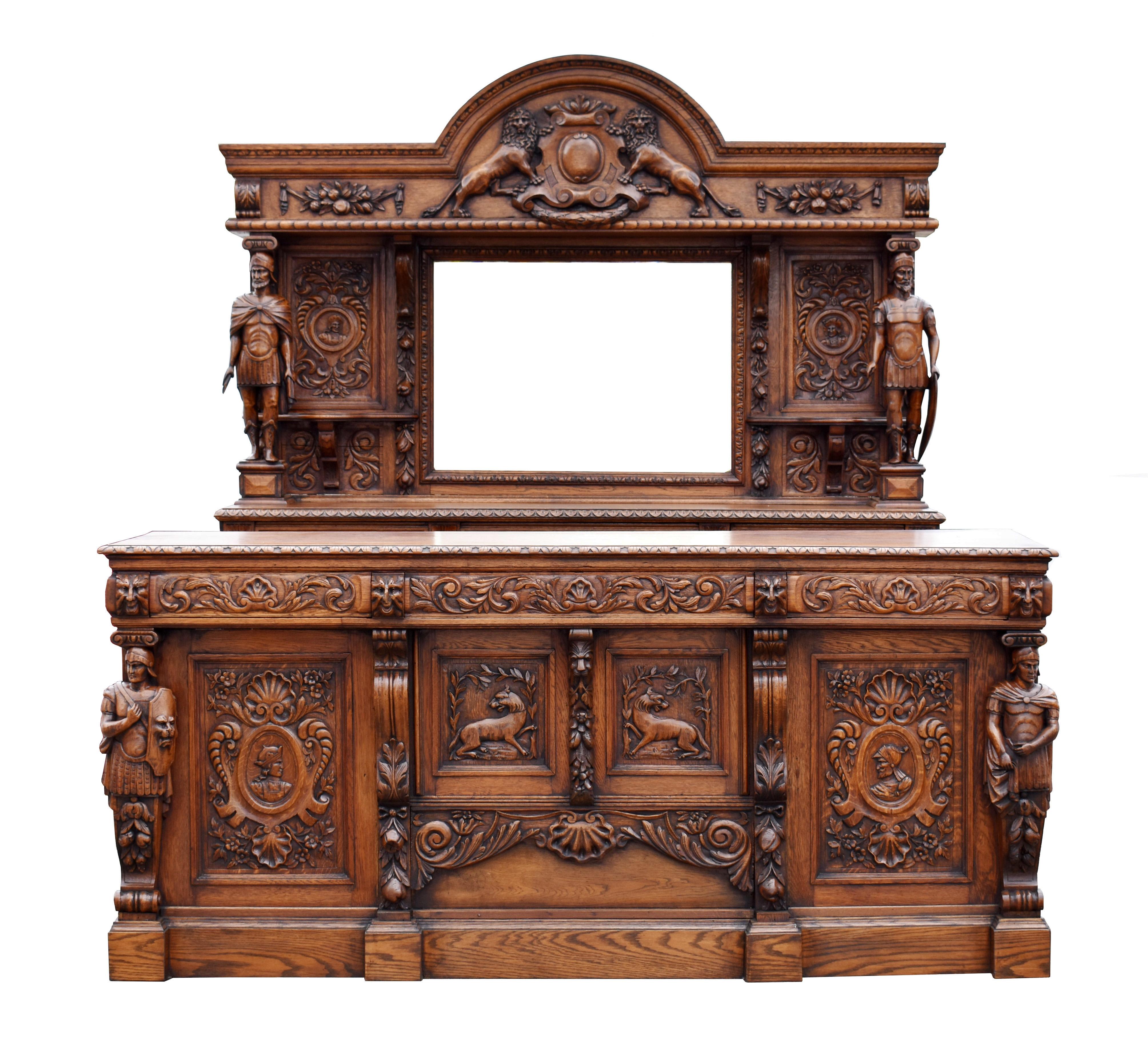 For sale is a very good quality English Victorian hand carved oak front and back bar. The arched pediment having an ornately carved lion motif in the center, supported by well carved figures either side of carved panels and a beveled mirror to the