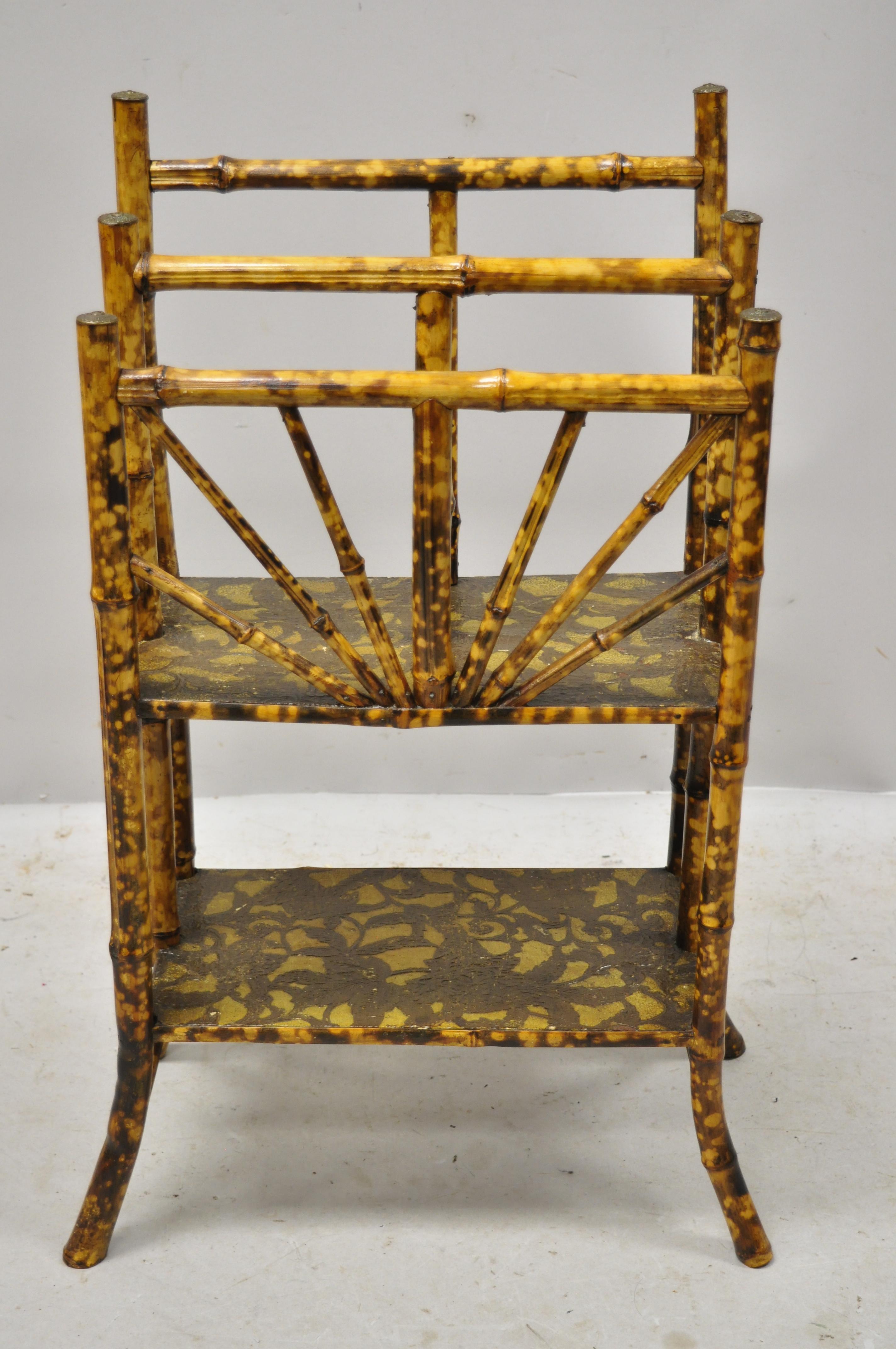 19th century English Victorian charred bamboo 2-tier magazine rack stand. Item features a lower shelf, charred finish, 2 magazine slots, solid bamboo construction, very nice antique item, circa late 19th century. Measurements: 32