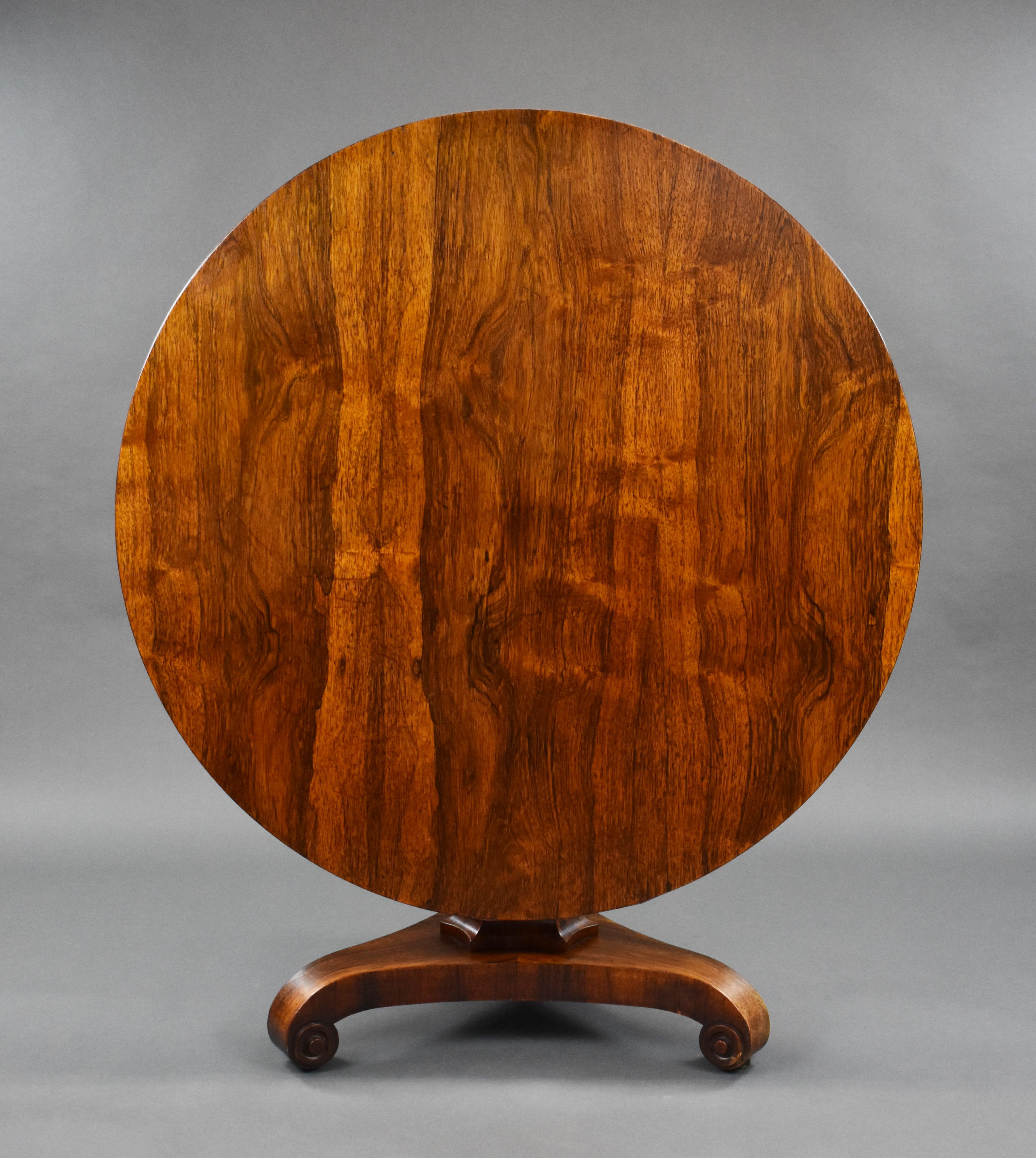 For sale is a Victorian rosewood circular breakfast table, having a well figured top above a shaped stem, over a platform base standing on scroll feet raised on original castors. The table remains in good condition, showing minor wear commensurate