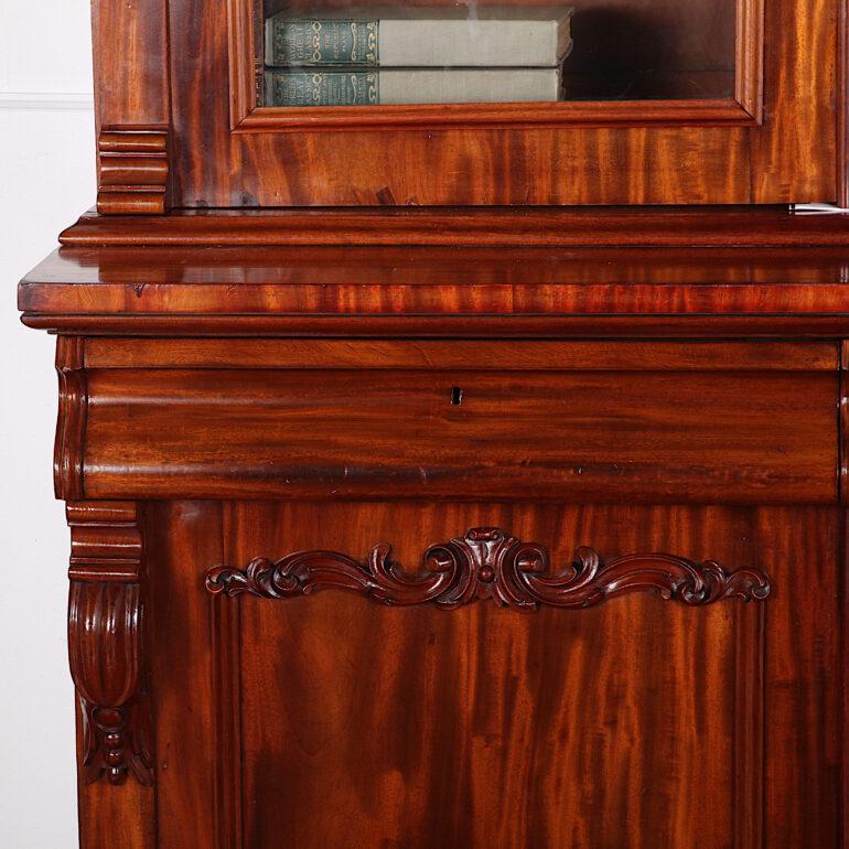 European 19th Century English Victorian Figured Mahogany Bookcase with Carved Details