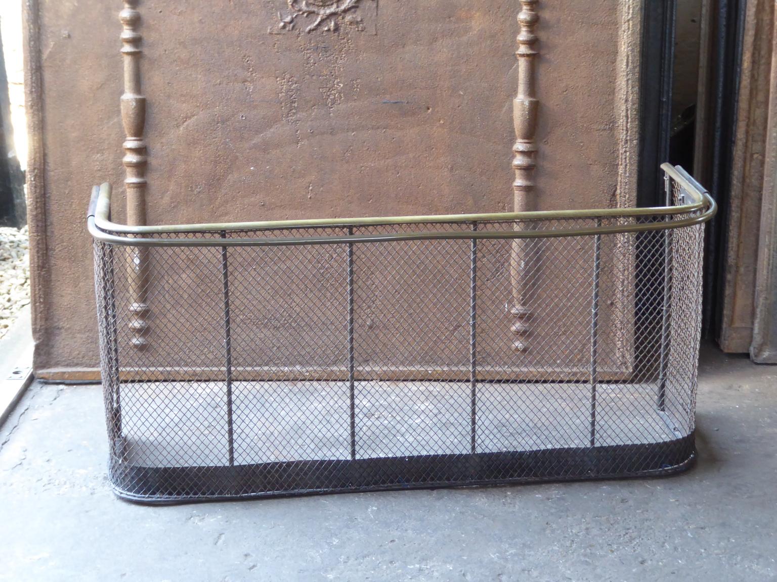 19th century English Victorian fireguard, fireplace guard made of brass, iron and iron mesh. The fire guard is in a good condition and is fully functional.







   