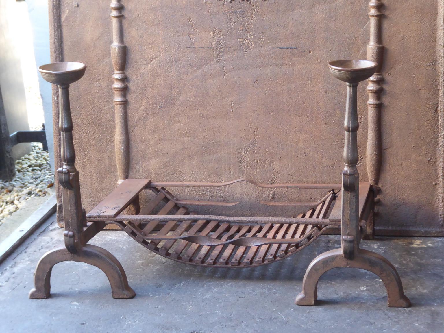19th century English Victorian fireplace grate made of cast iron and wrought iron. The grate has a natural brown patina. Upon request it can be made black. The total width of the front of the grate is 37.5 inch (95 cm).