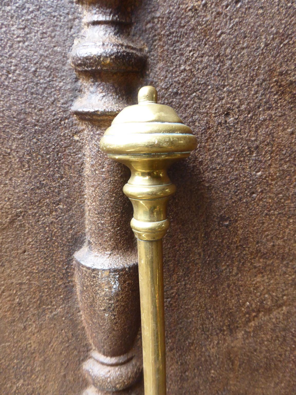 19th century English Victorian fireplace poker made of brass and wrought iron.







