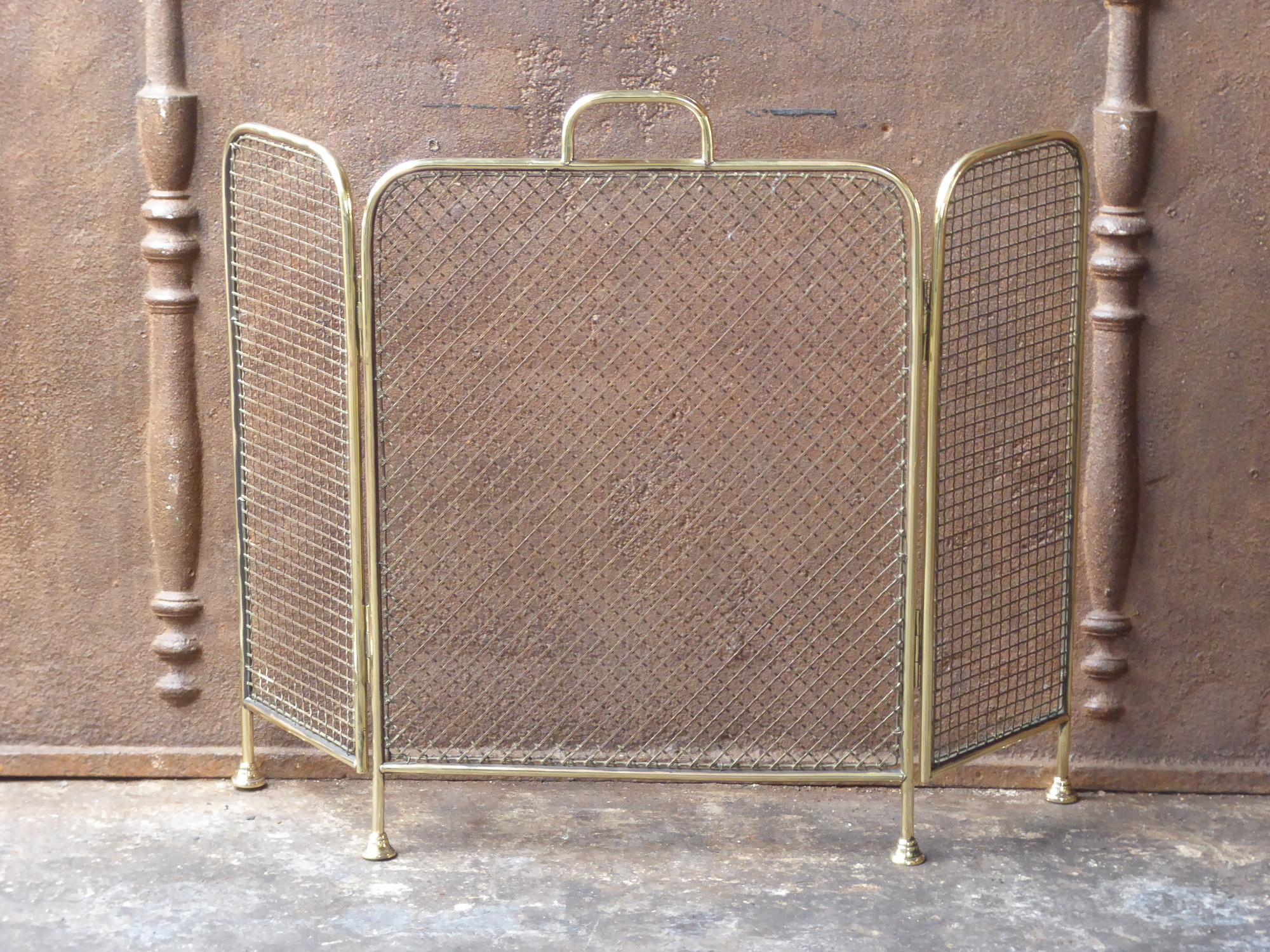 19th century English Victorian fireplace screen made of polished brass and iron mesh.







 