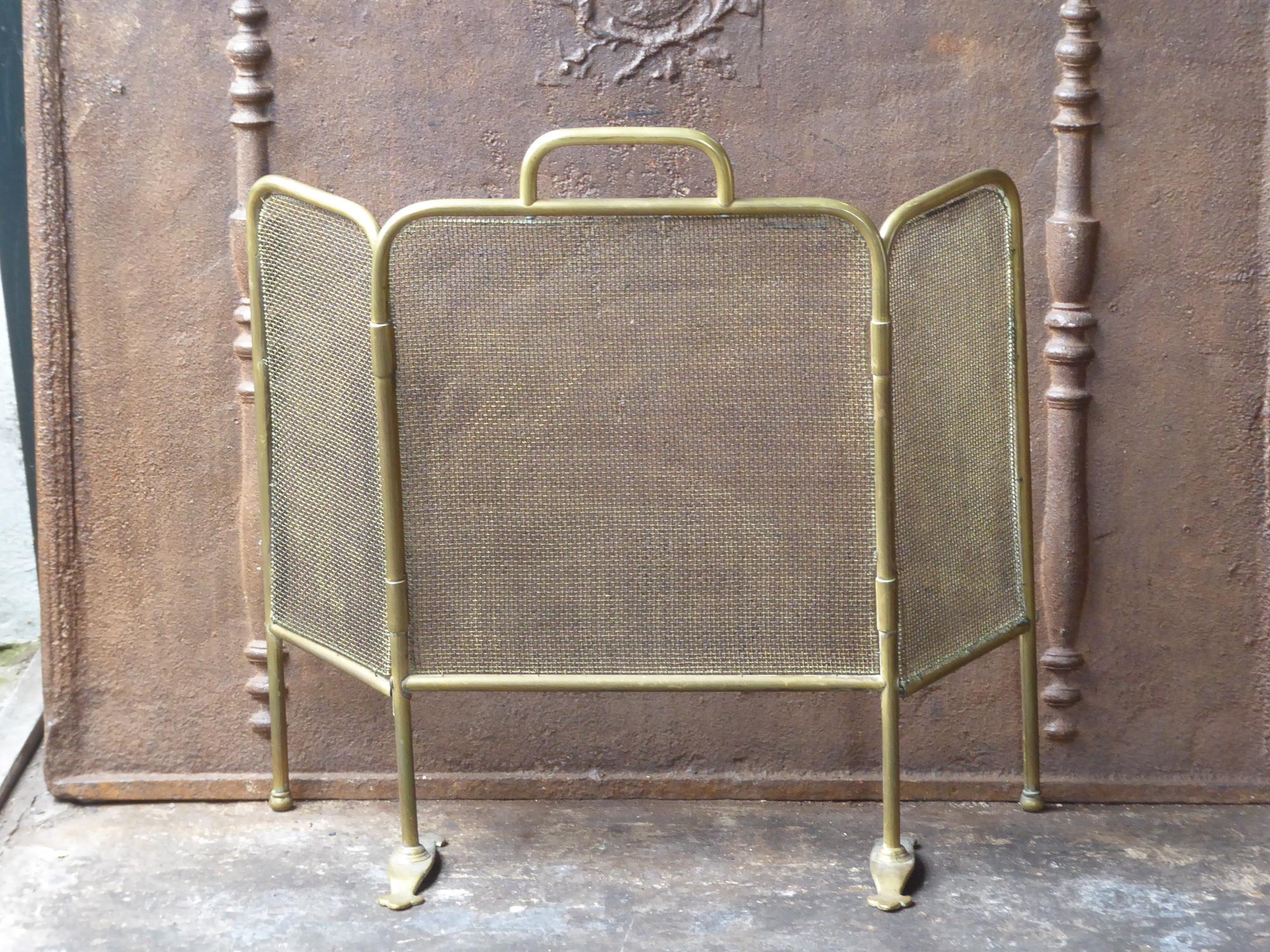 19th century English Victorian fireplace screen made of brass and iron mesh.







 