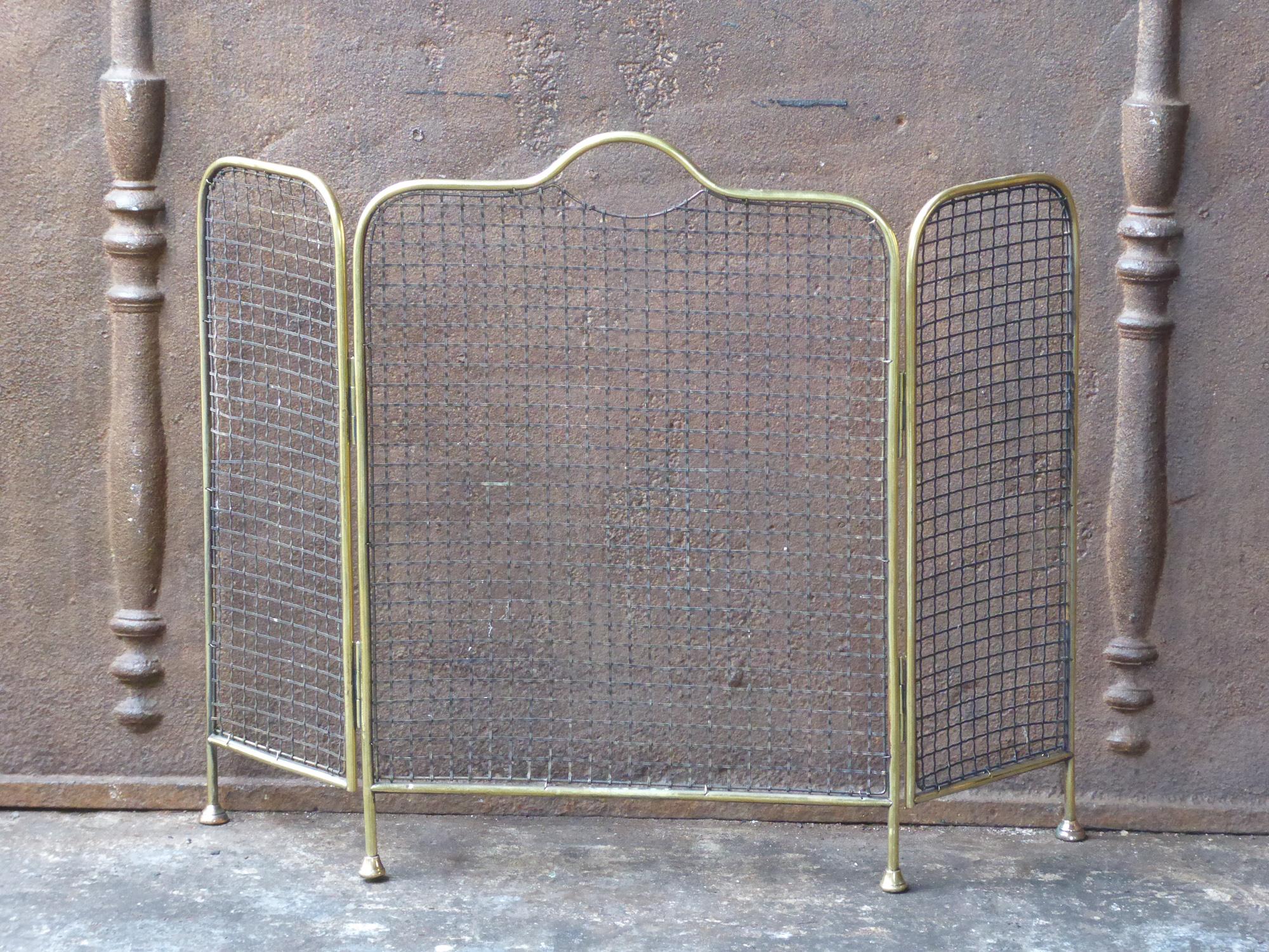 19th century English Victorian fireplace screen made of polished brass and iron mesh.







 